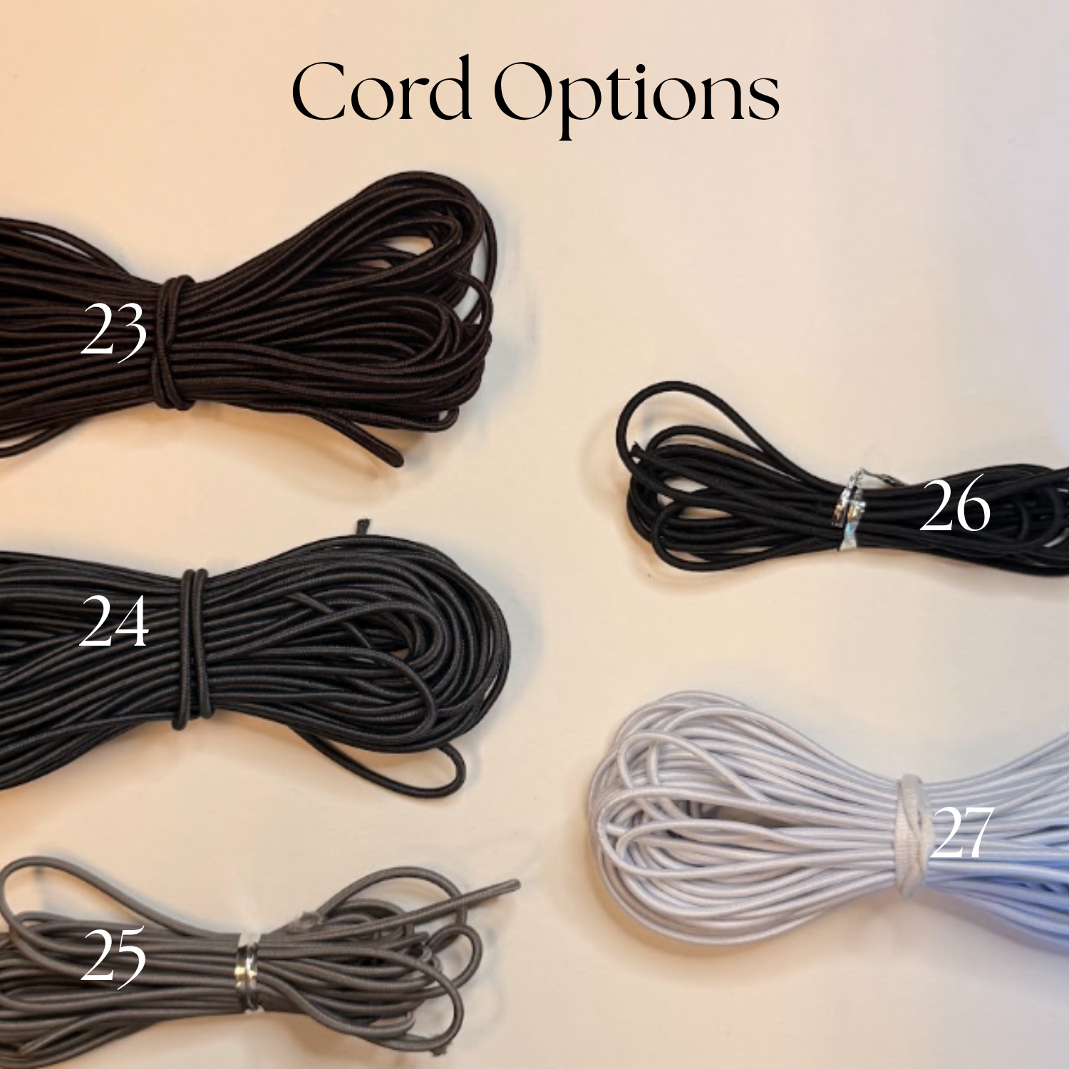Several bundles of cord options in different colors and sizes, labeled with numbers 23 through 27, on a white surface with the text 'Cord Options' at the top.