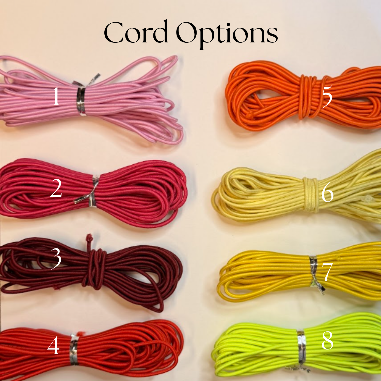 Various colored cords organized in bundles on a white surface, labeled from 1 to 8 with black numbers.