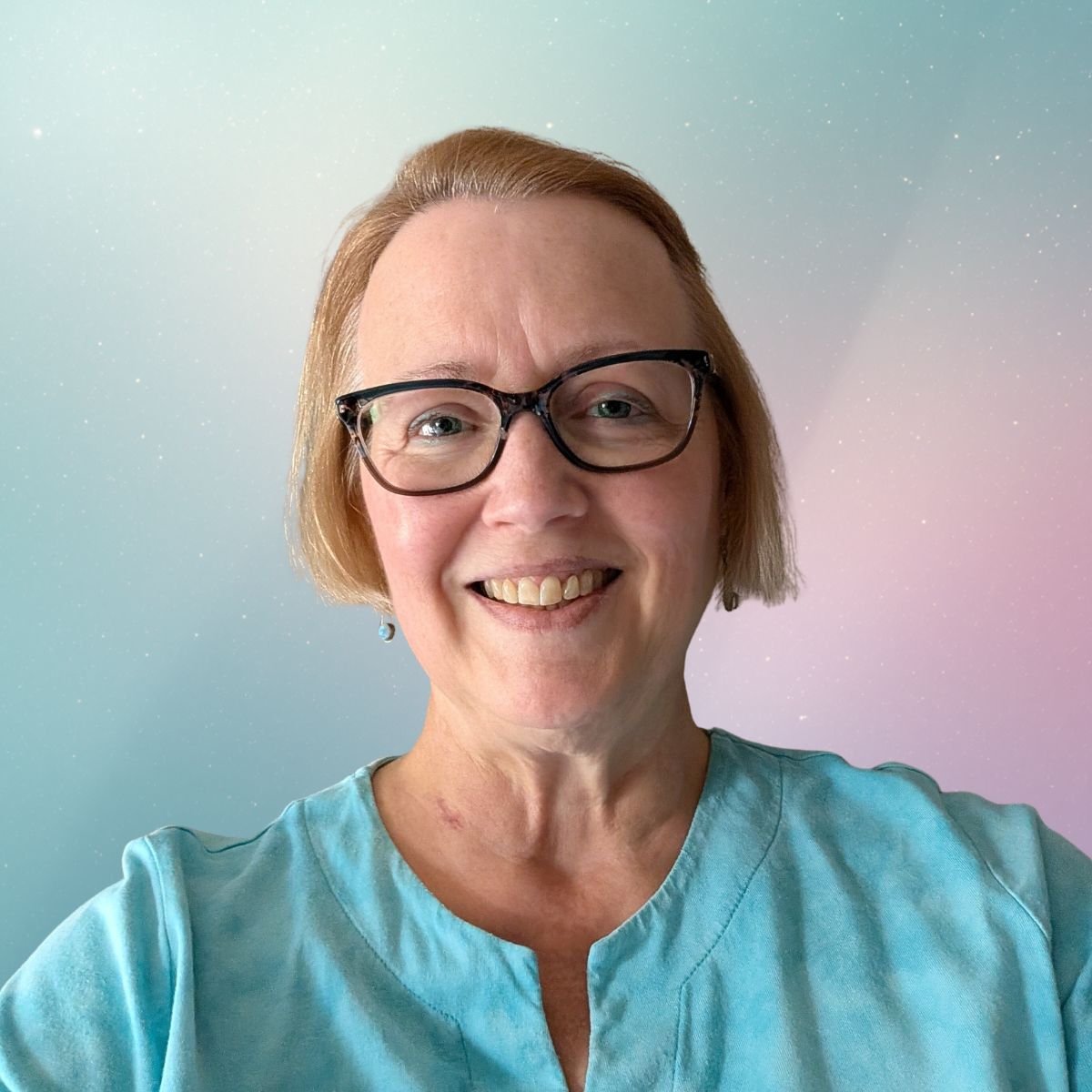 A woman in a tie die top with pastel backgrounds