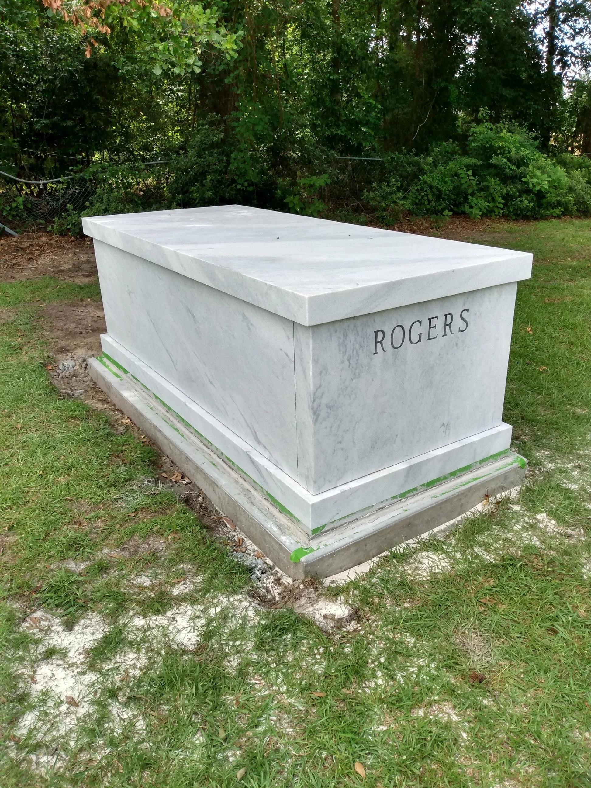 A custom white marble mausoleum with personalized engraving.