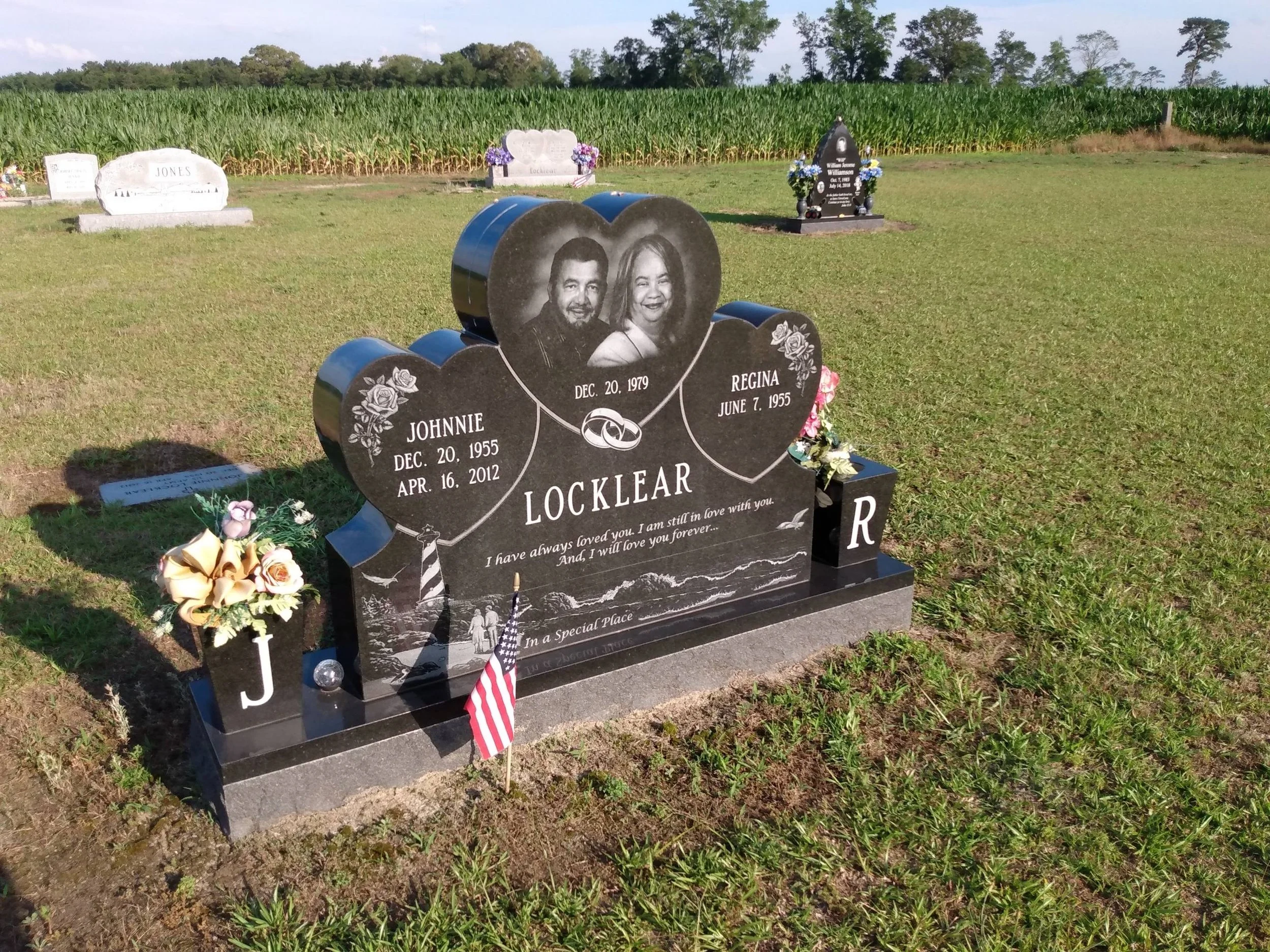 Companion headstone featuring engraved photos of a husband and wife.