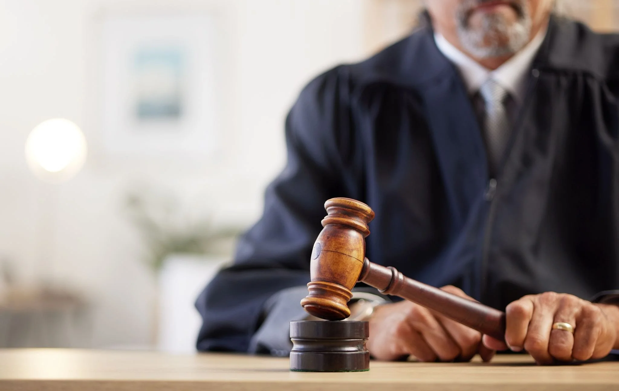 Cropped view of a circuit judge with gavel about to make an important court decision