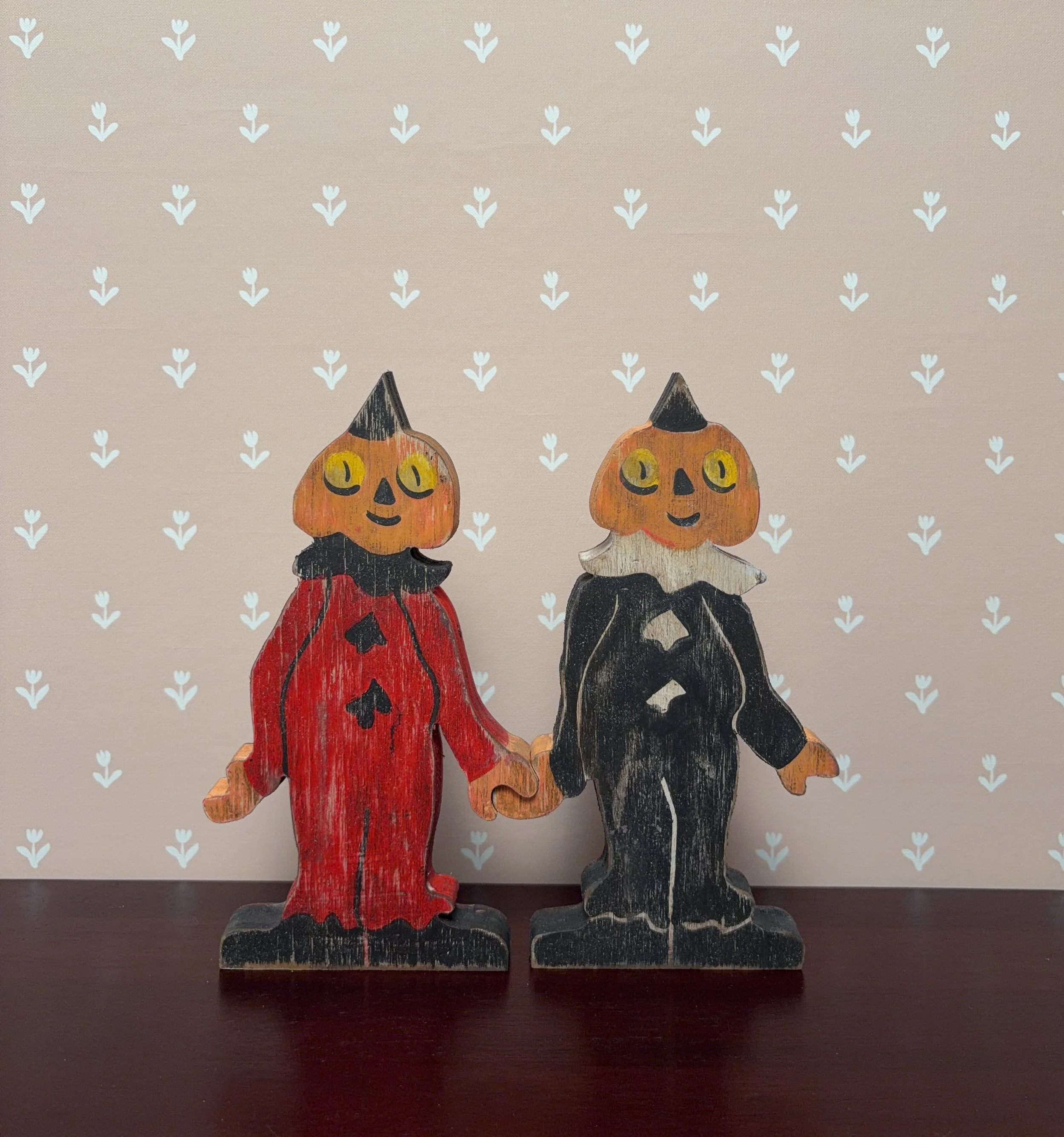 Clown friends holding hands