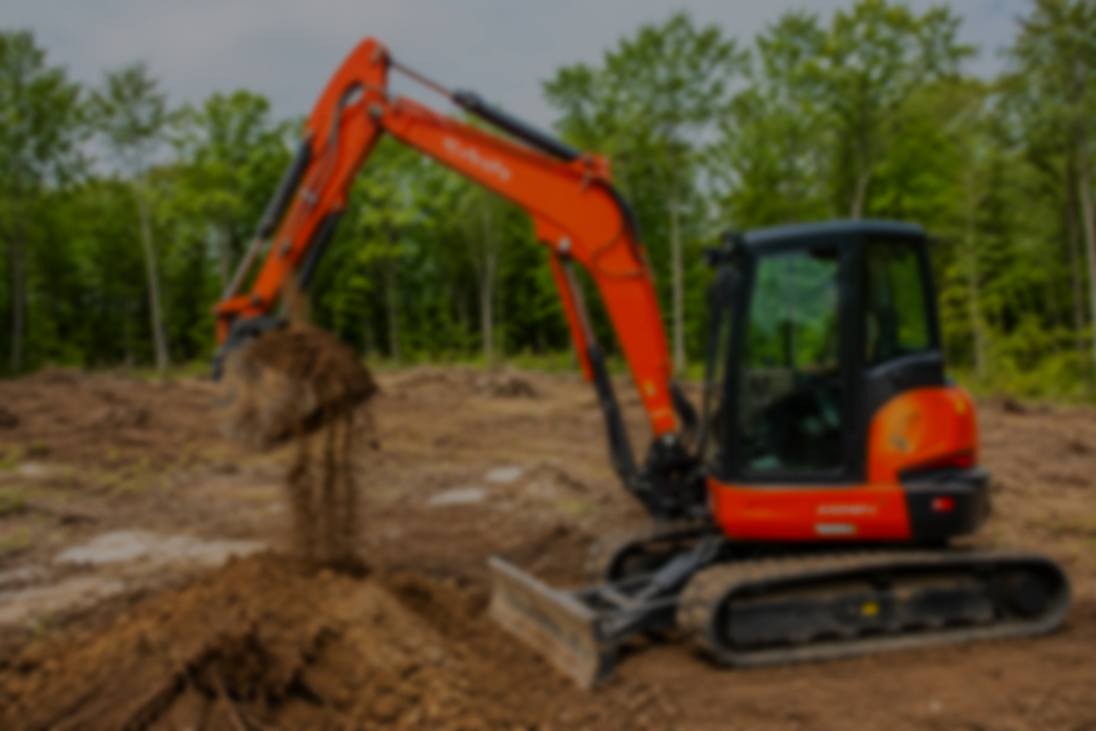 Blurry photo of an orange mini excavator digging into soil in a forested area.