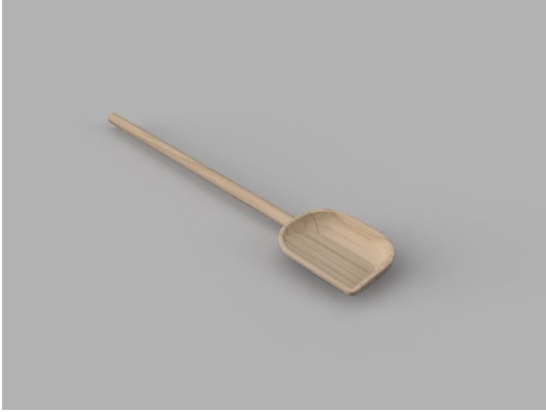A wooden spoon with a long handle and a rectangular scoop, lying on a gray surface.