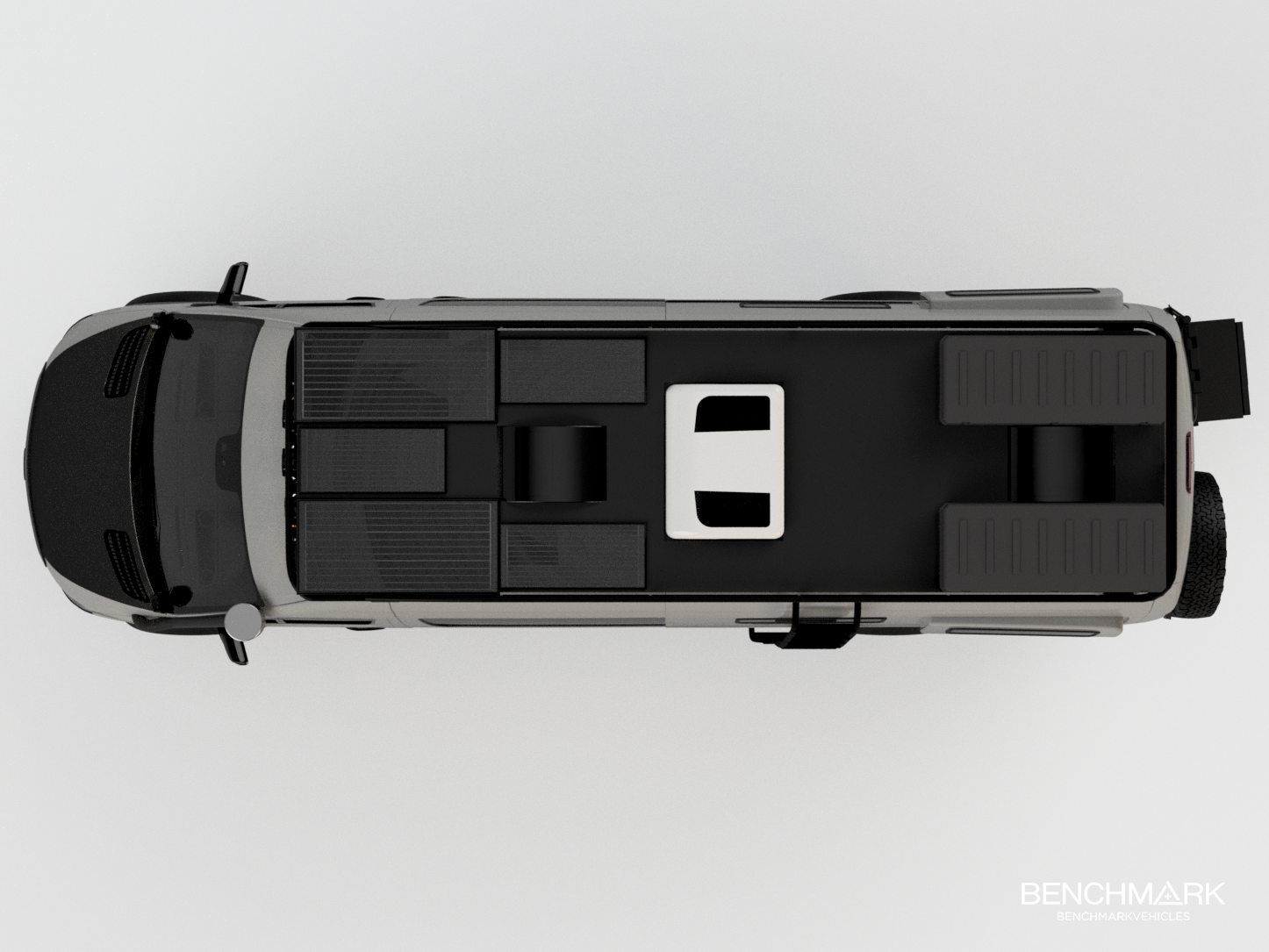 Top-down view of a recreational vehicle with black and gray exterior and solar panels on the roof.