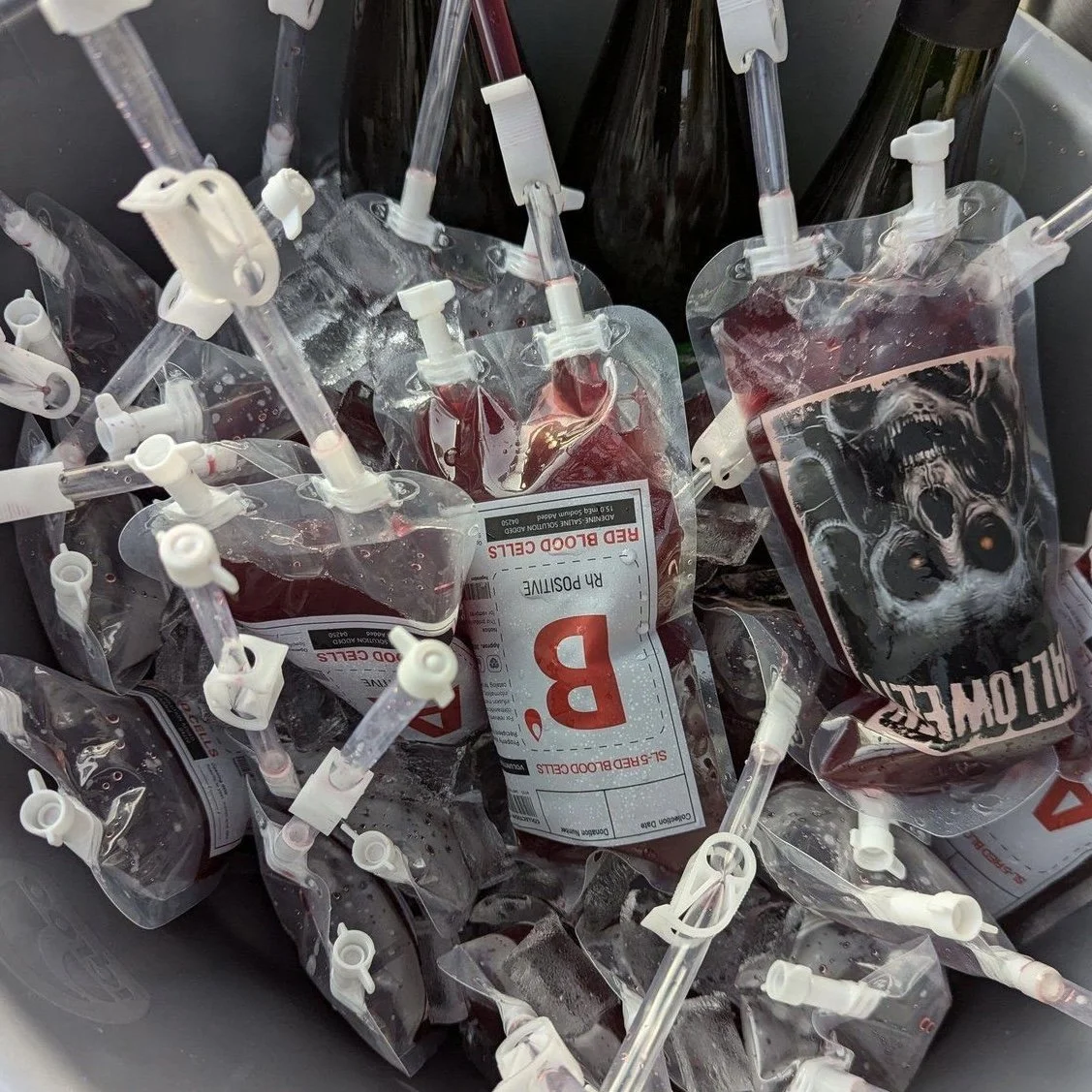 A pile of empty blood donation bags connected to blood tubing.
