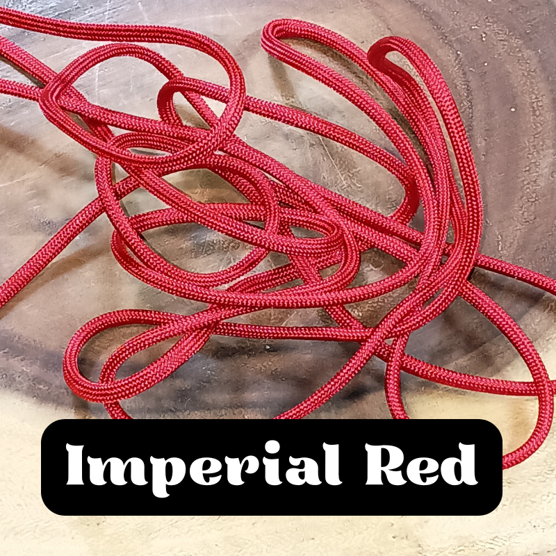 A tangled mess of red rope on a wooden surface with the label 'Imperial Red' in white text on a black background.