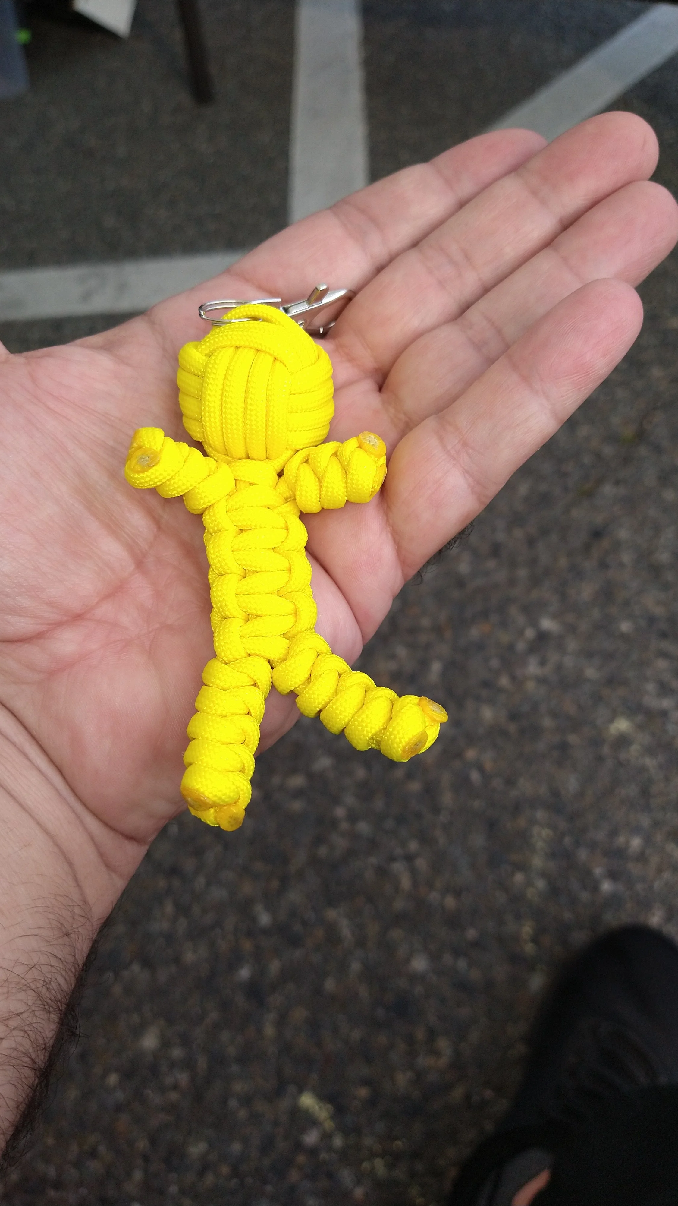 Yellow paracord Buddiez keychain with a metal keyring at the top.