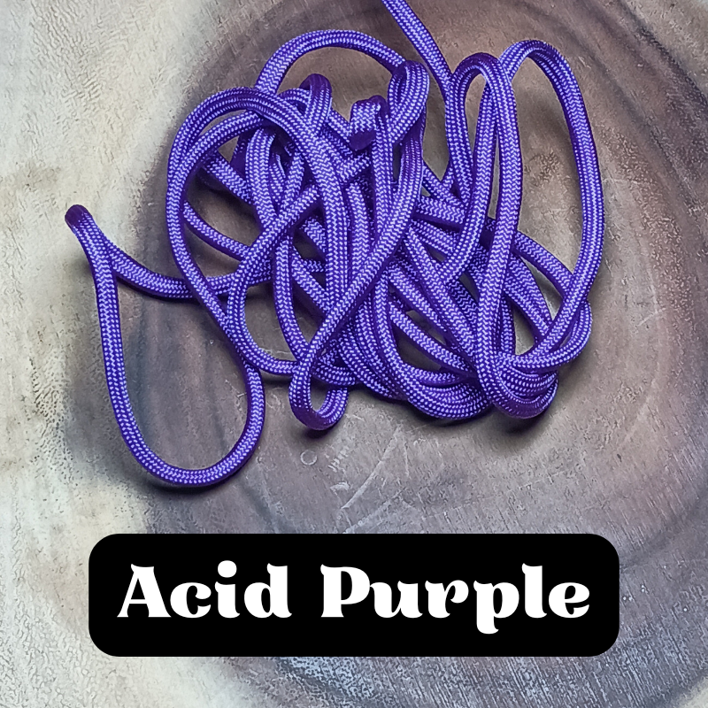 A tangled purple shoelace on a wooden surface with the label 'Acid Purple' in bold white text on a black background.