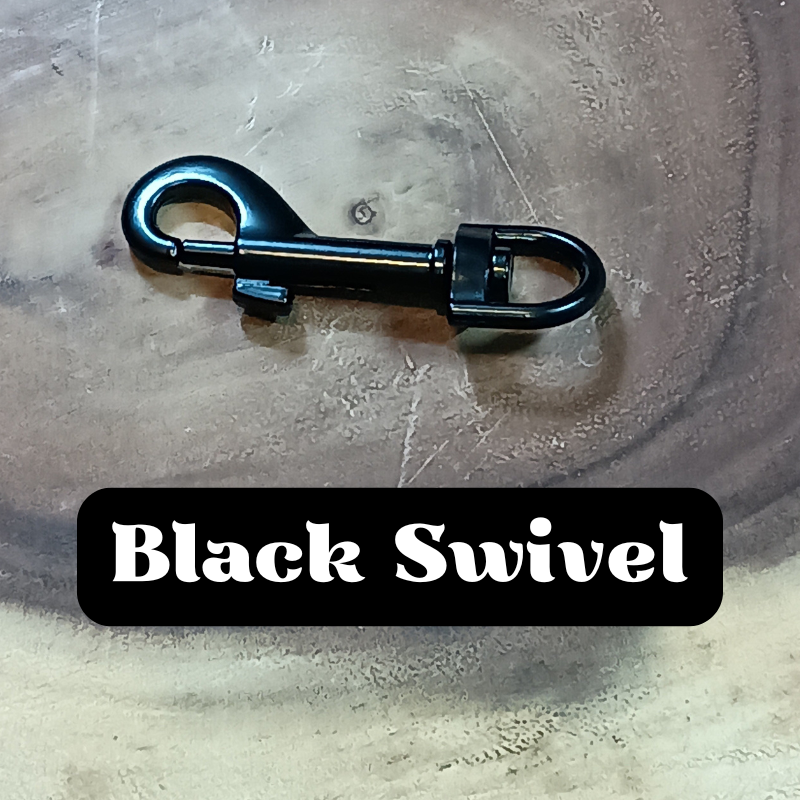 A black swivel snap hook on a wooden surface with the label "Black Swivel" in black and white text.