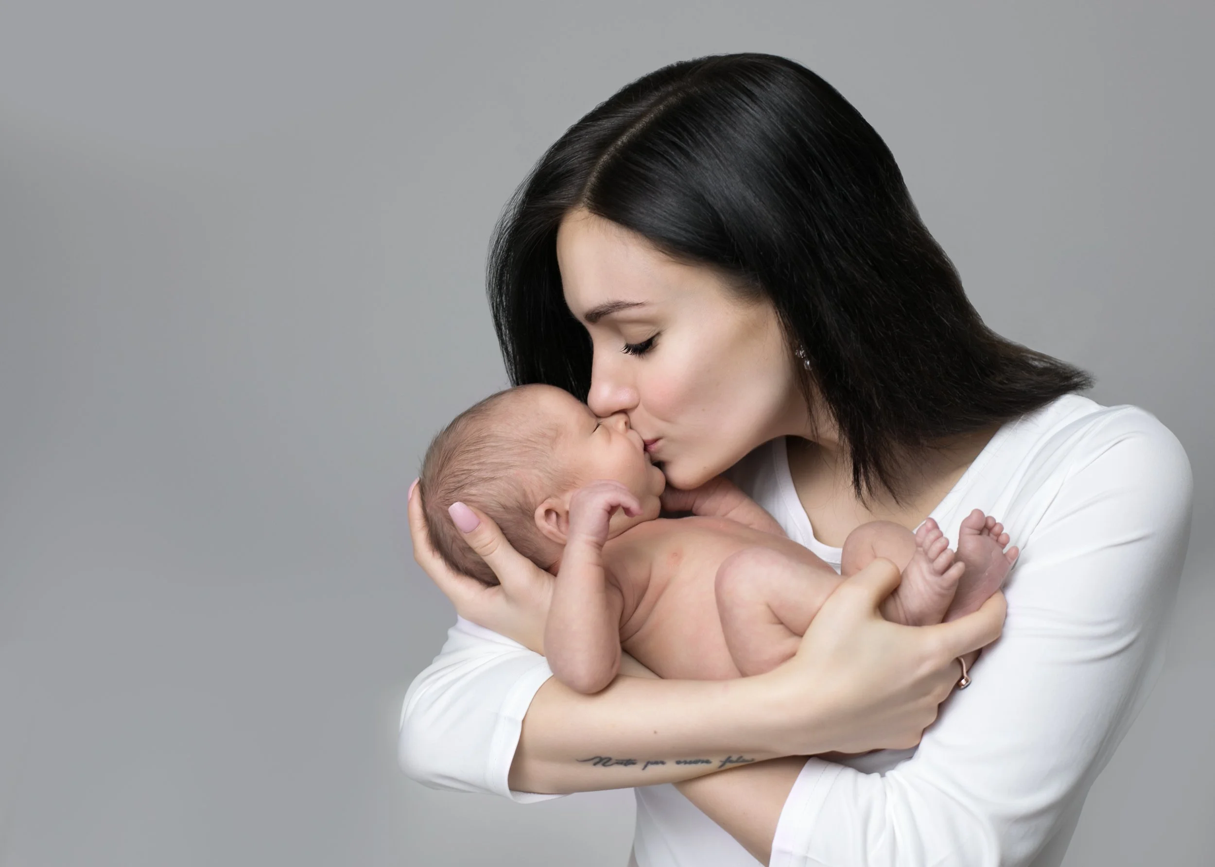 Mini newborn photography session at home in London — wrapped baby and family portraits by Kate See