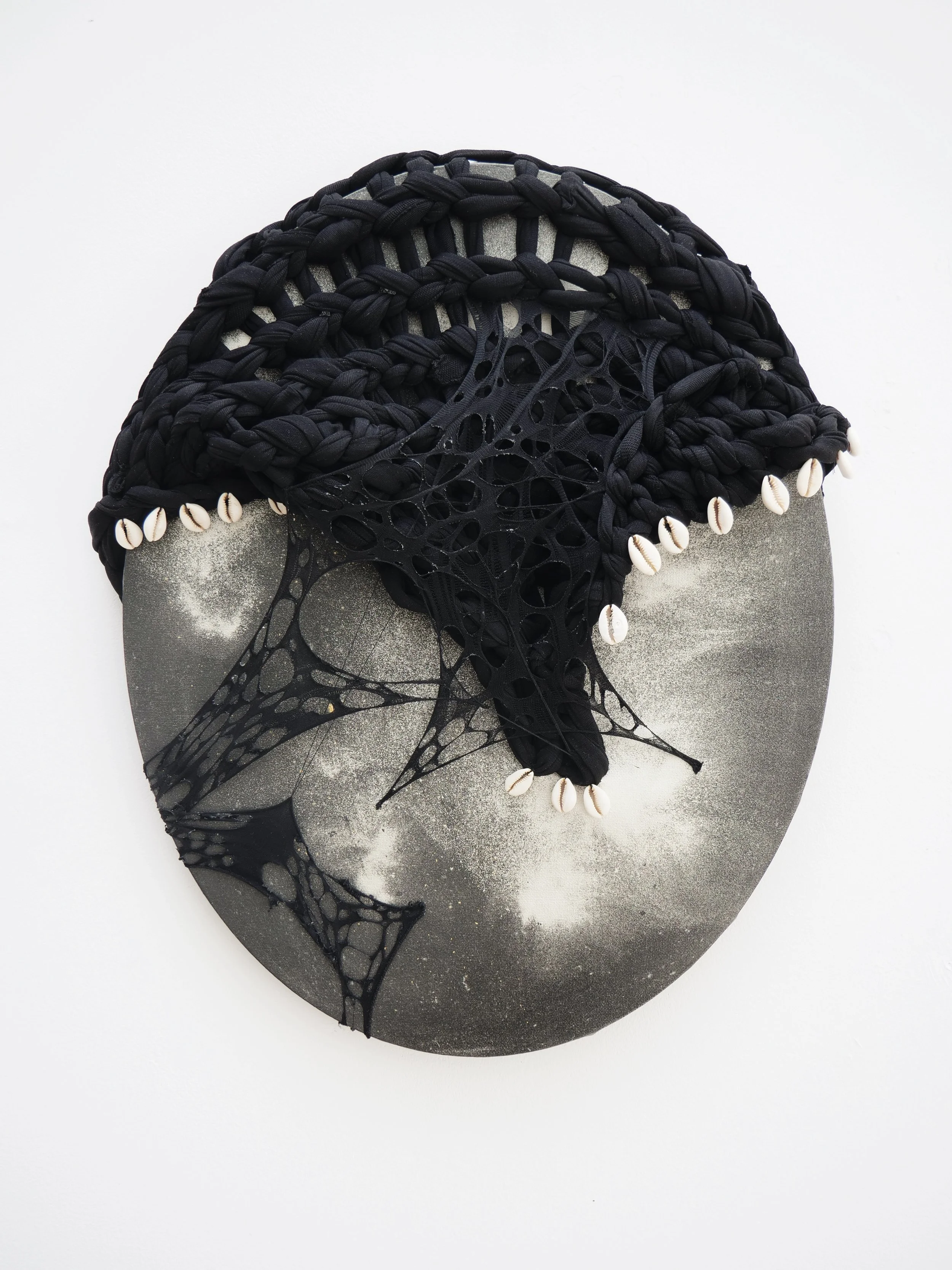 Luminous Black Matter I, 2024, 40 x 52 x 1.75cm, eco-friendly water-based acrylic paint, 24ct gold powder, 12ct gold powder, nylon tights, recycled PET thread, cowrie shells and cotton canvas 