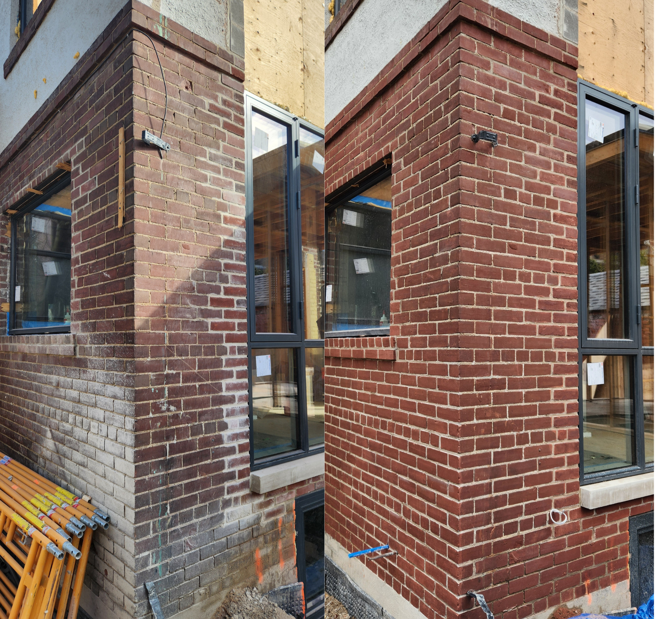 Close-up of the corner of a building under construction with red brick exterior. Some areas are still being finished, with visible construction materials and electrical wiring.