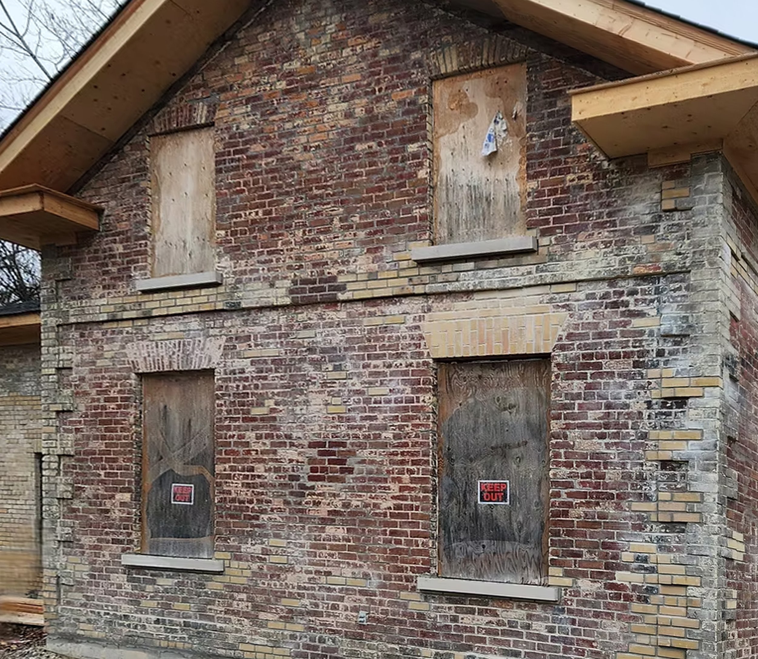 Weathered brick surface before colour restoration