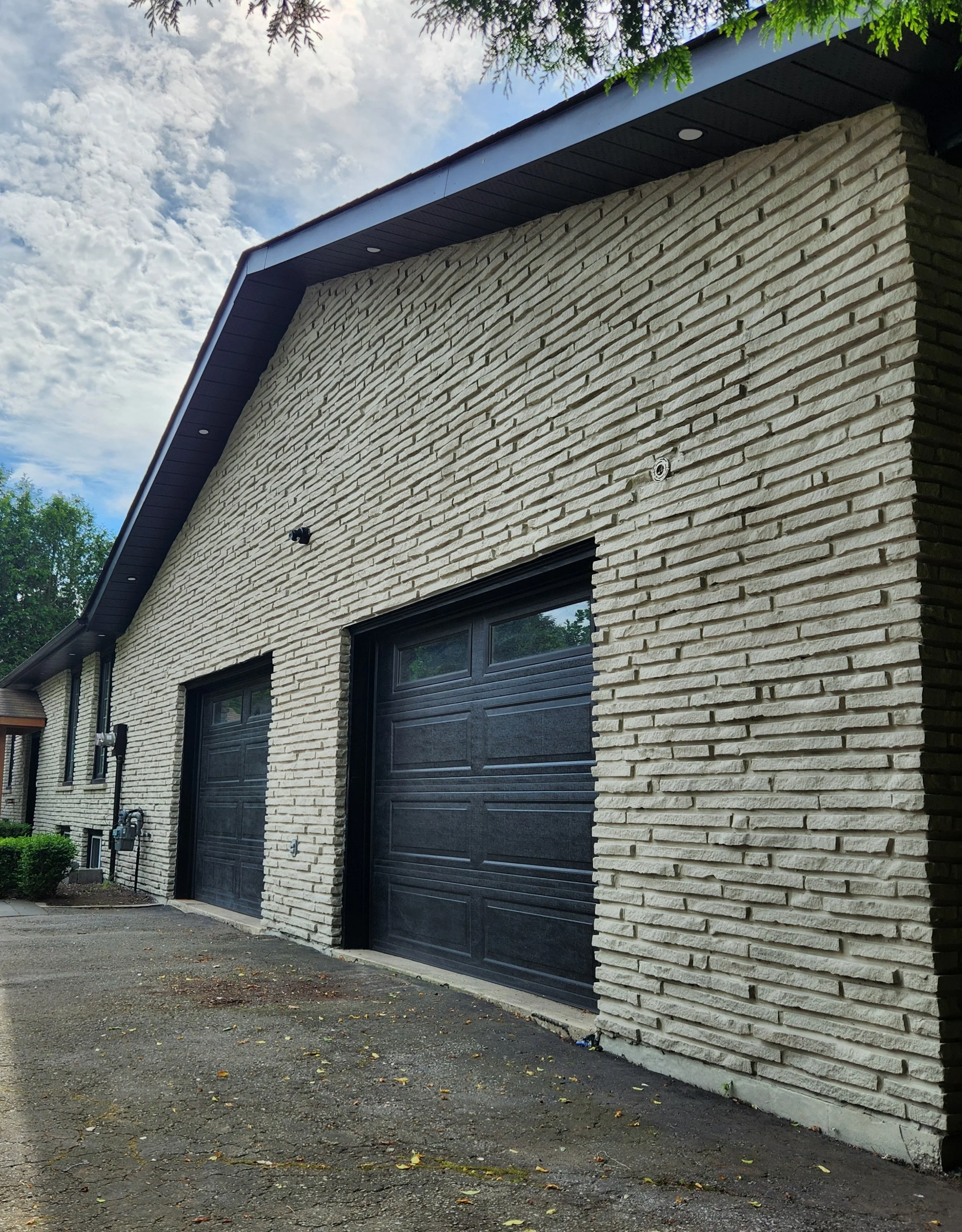 Grey masonry building exterior after colour change