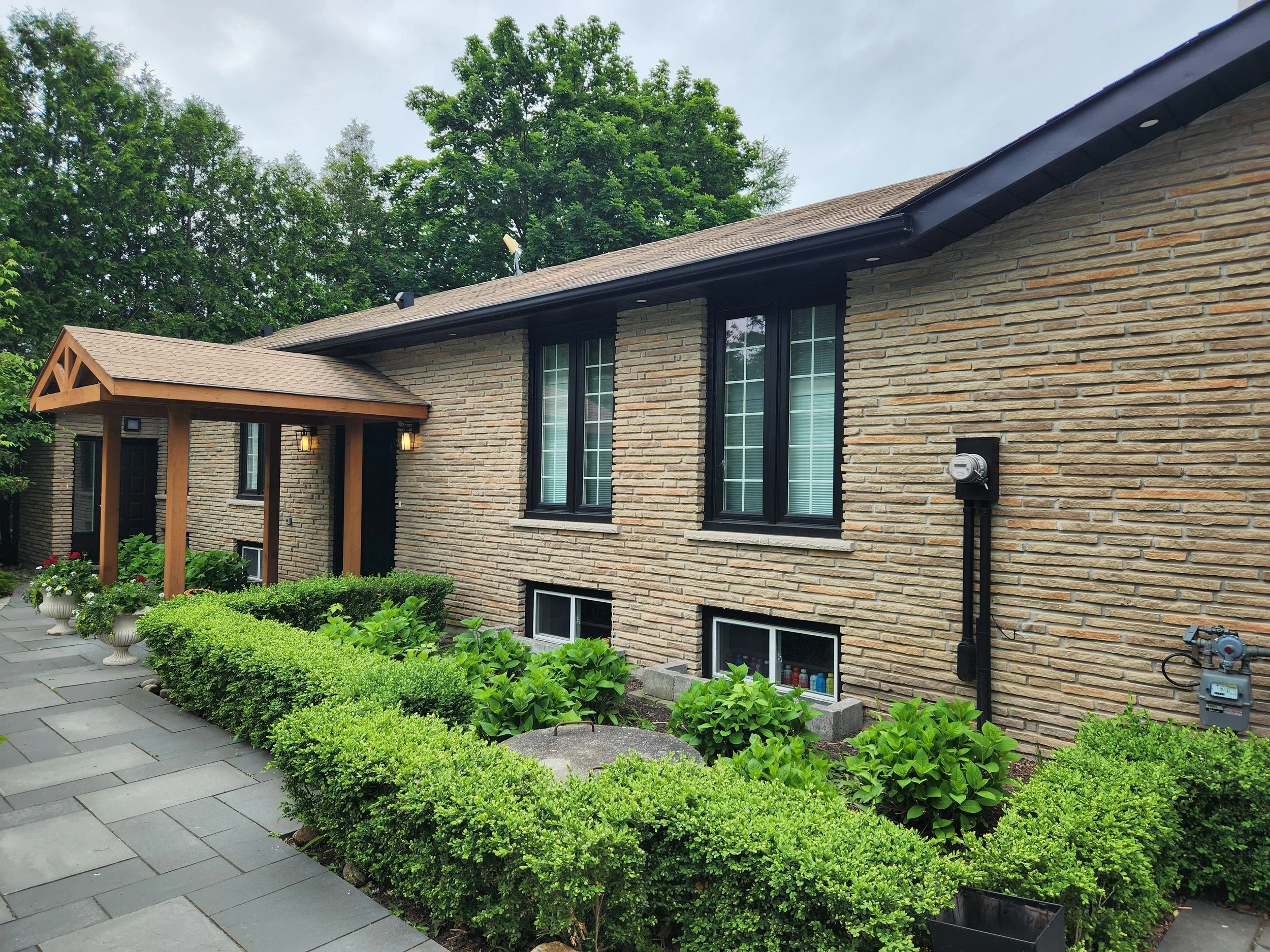 Residential brick home before masonry colour transformation