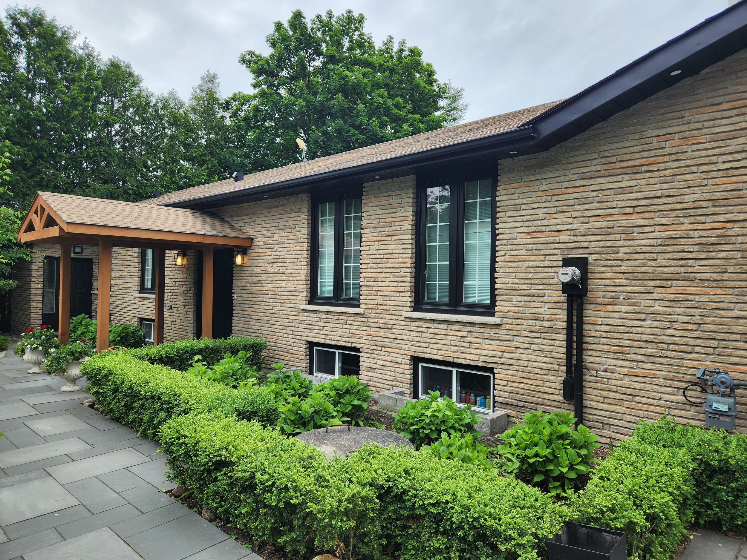 Residential brick home before masonry colour transformation