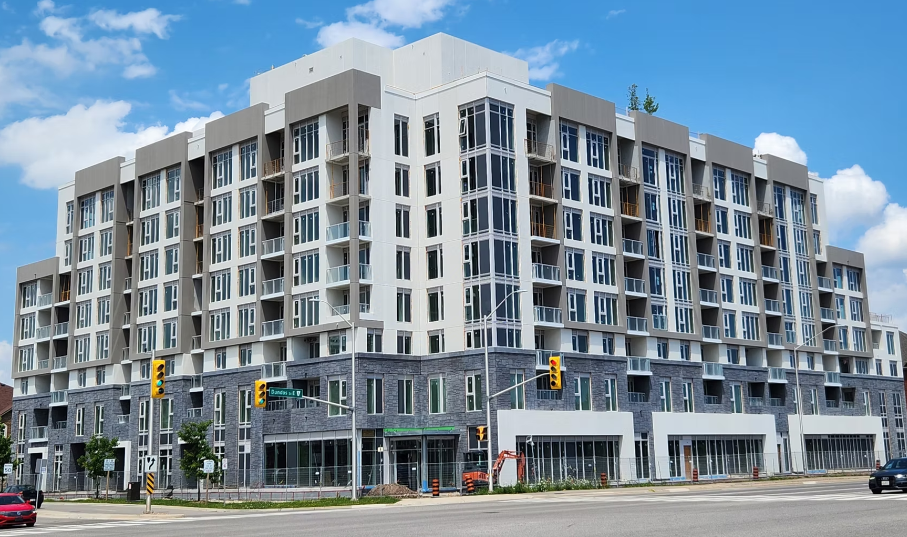 Precast condo building exterior after colour staining