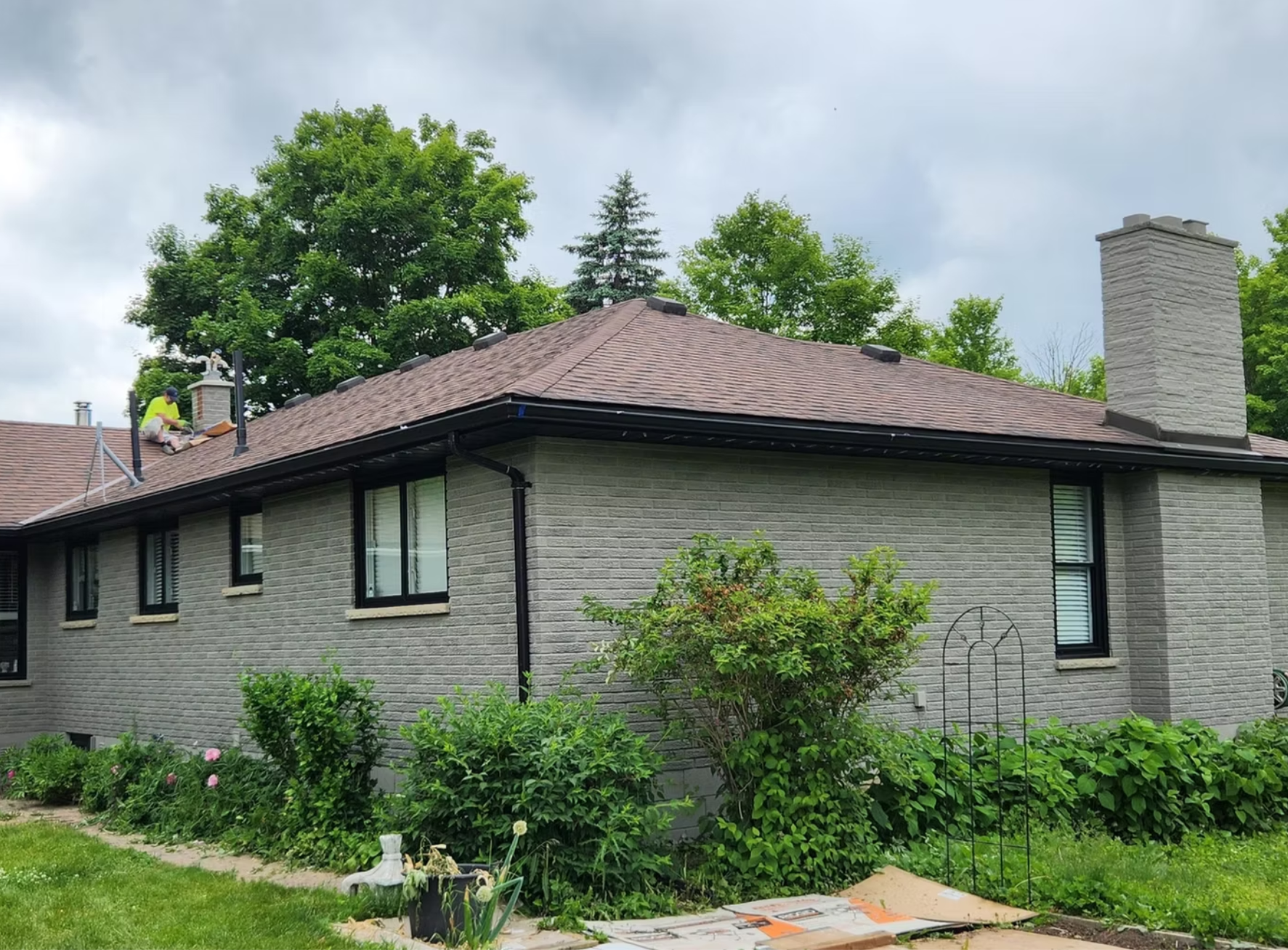 Stone bungalow exterior after light masonry staining