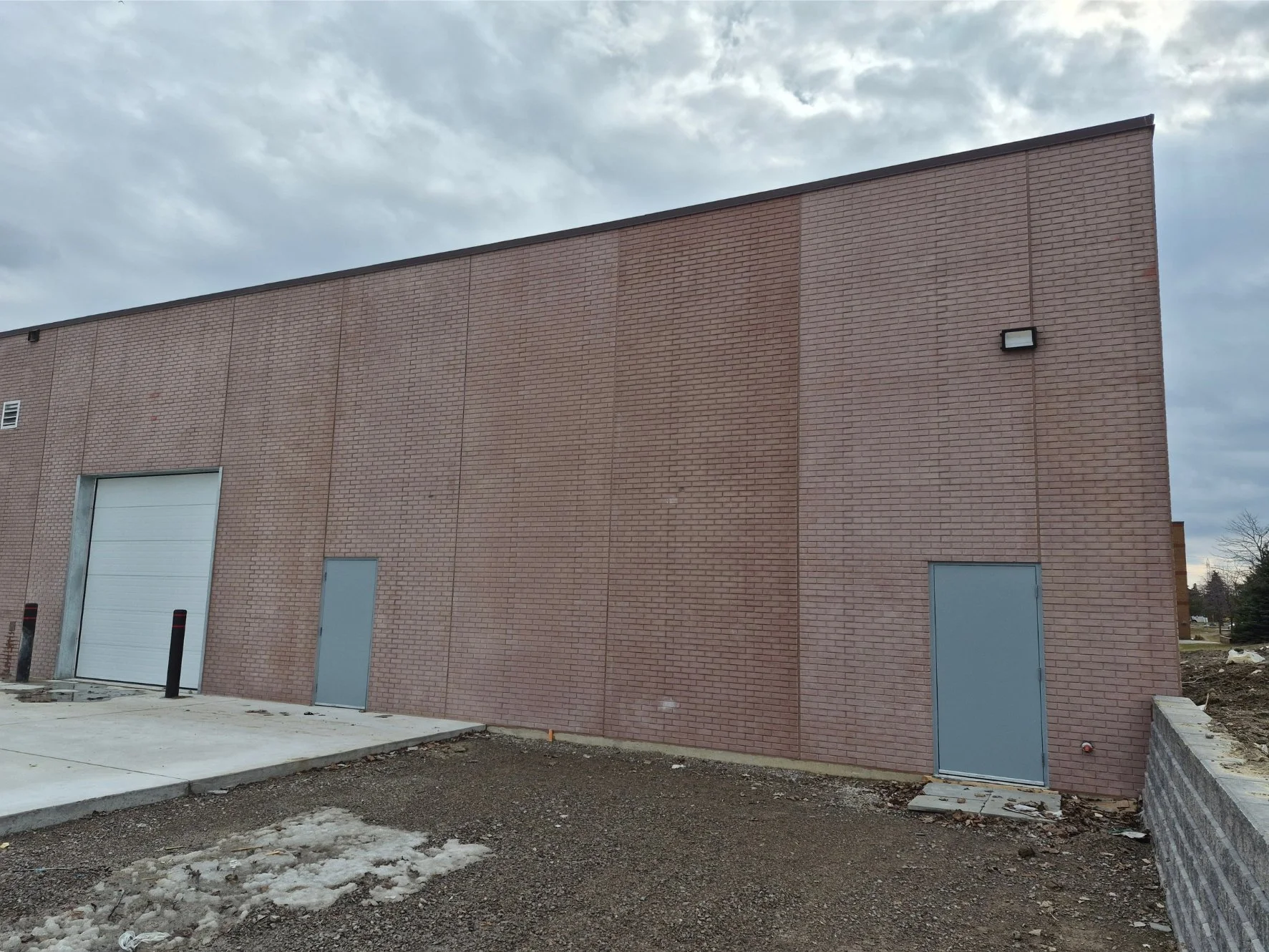 Large brick building before colour correction