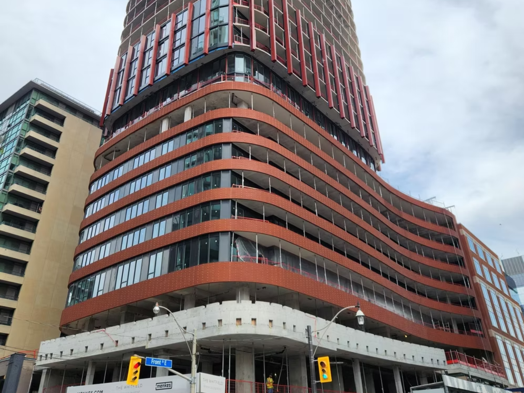 Red commercial building exterior after colour restoration