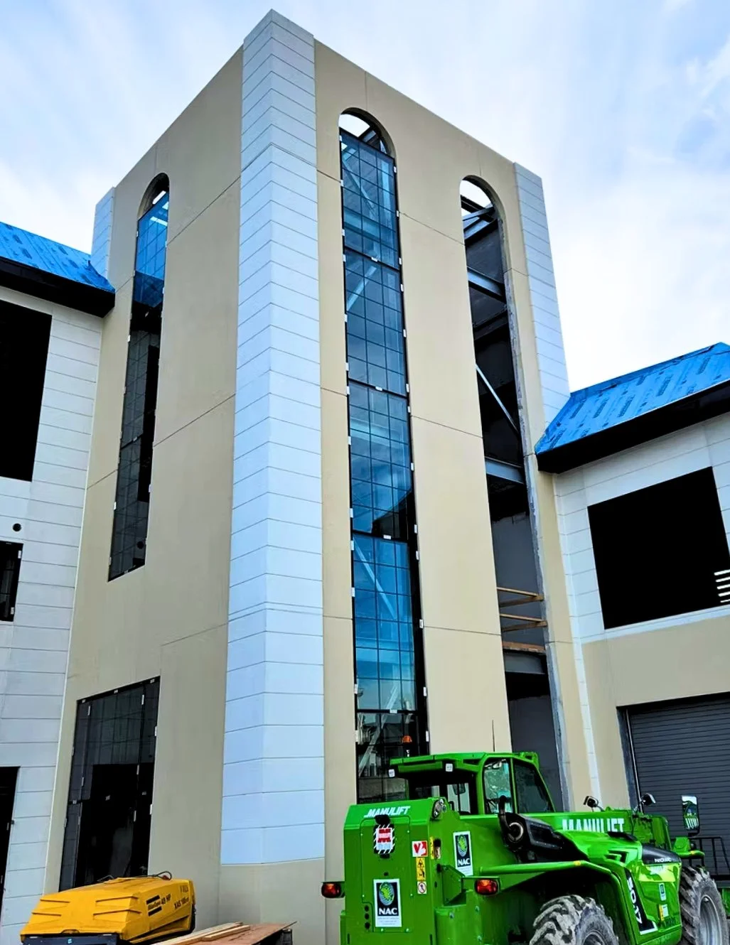 Tall concrete building exterior after colour staining