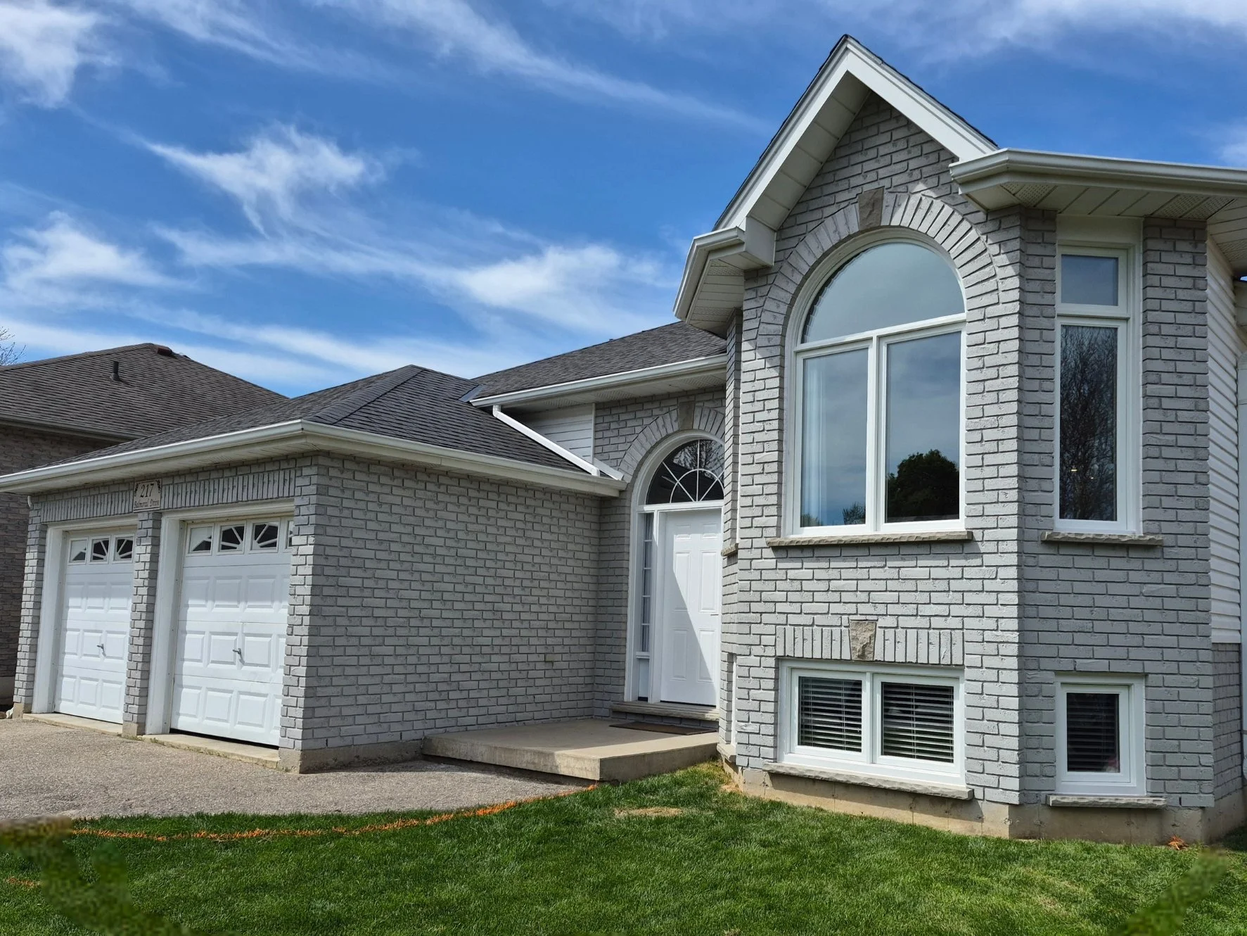 Brick house exterior after grey masonry staining