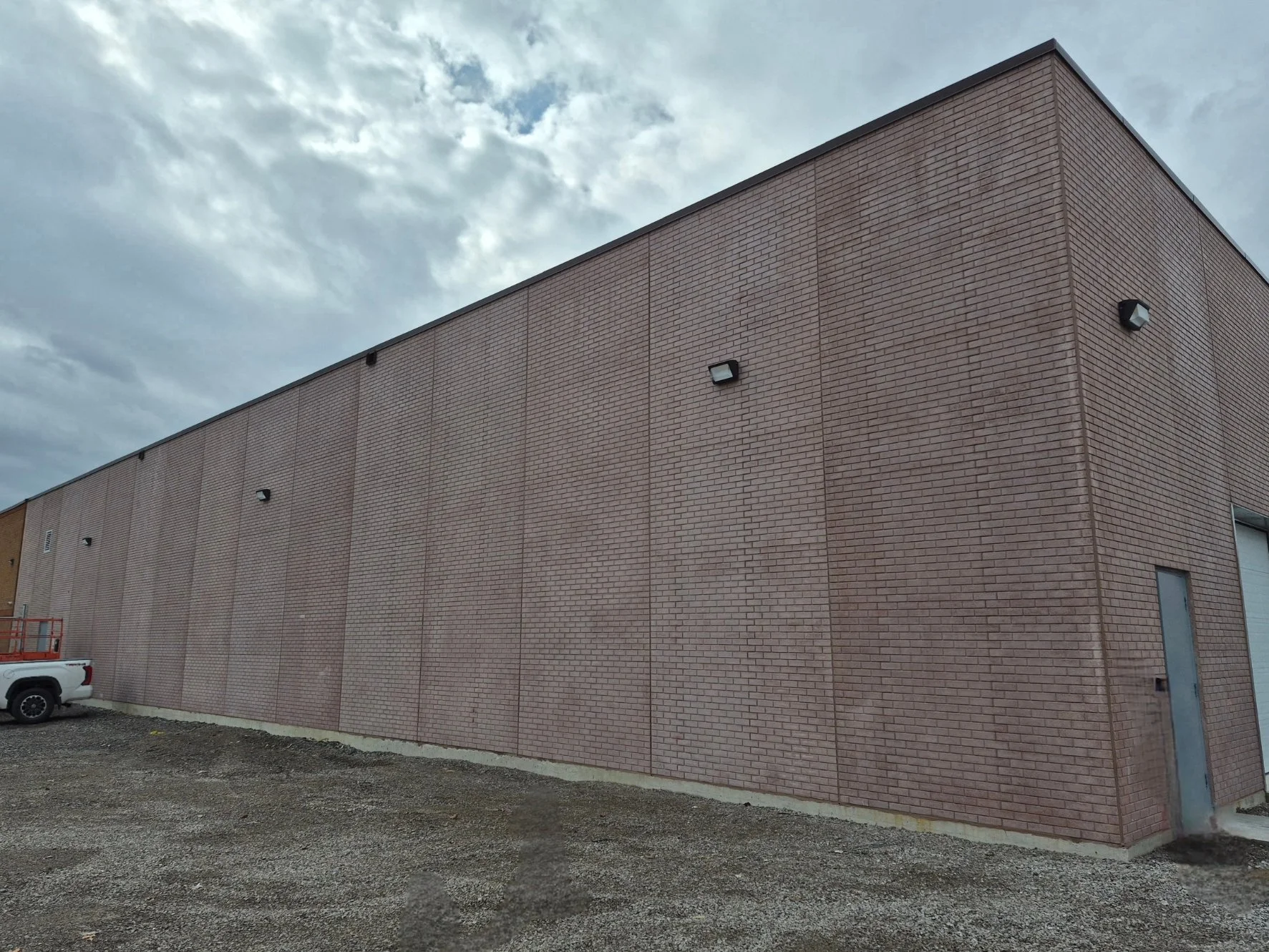 Large brick building before colour correction