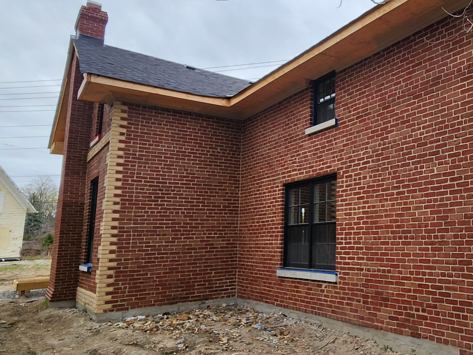 Red brick building after paint removal