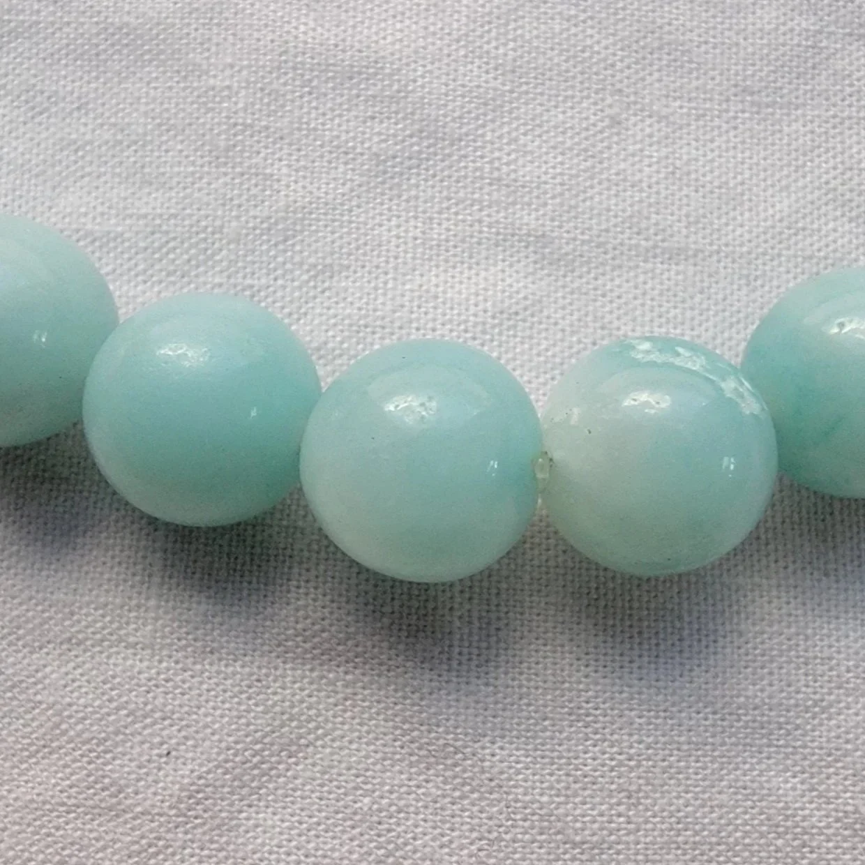 Close-up of the Aligned Amazonite intention bracelet highlighting the natural color and character of genuine Amazonite stone.