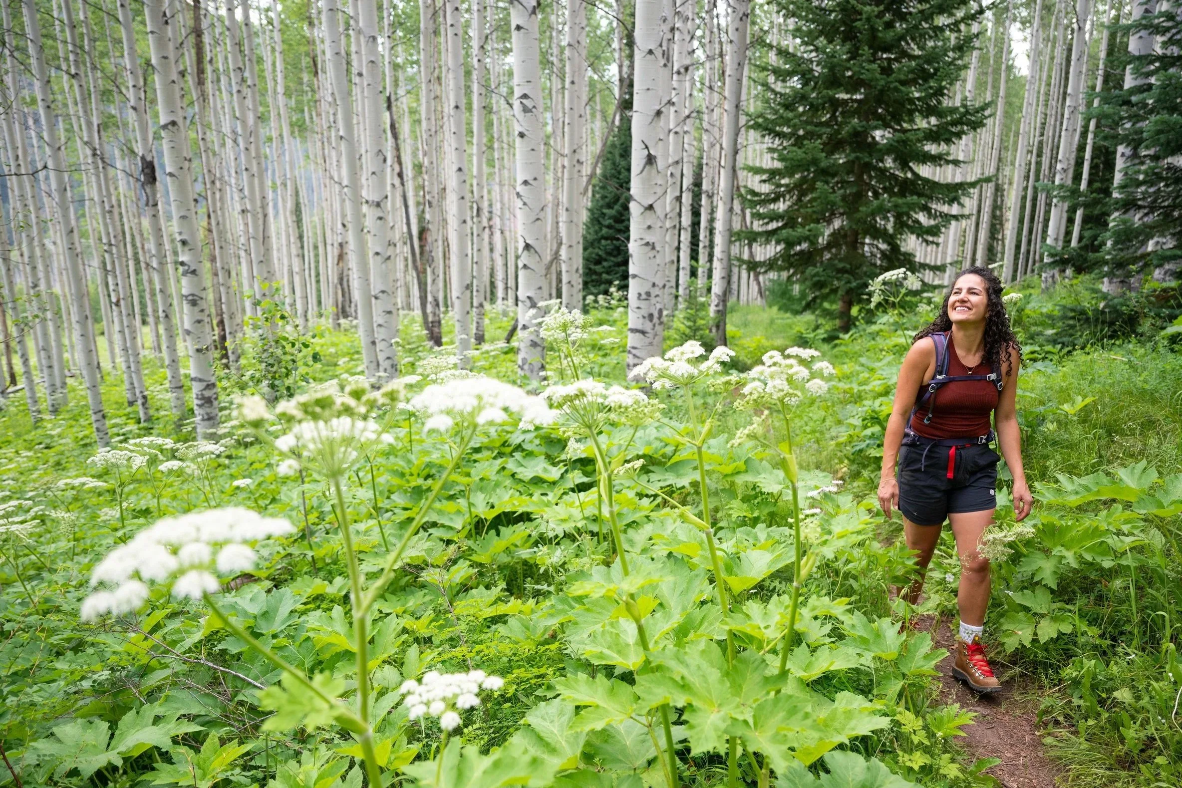 Danielle Huidekoper hiking in the Colorado mountains, reflecting her connection to the Vail Valley lifestyle and the communities she serves throughout the region.