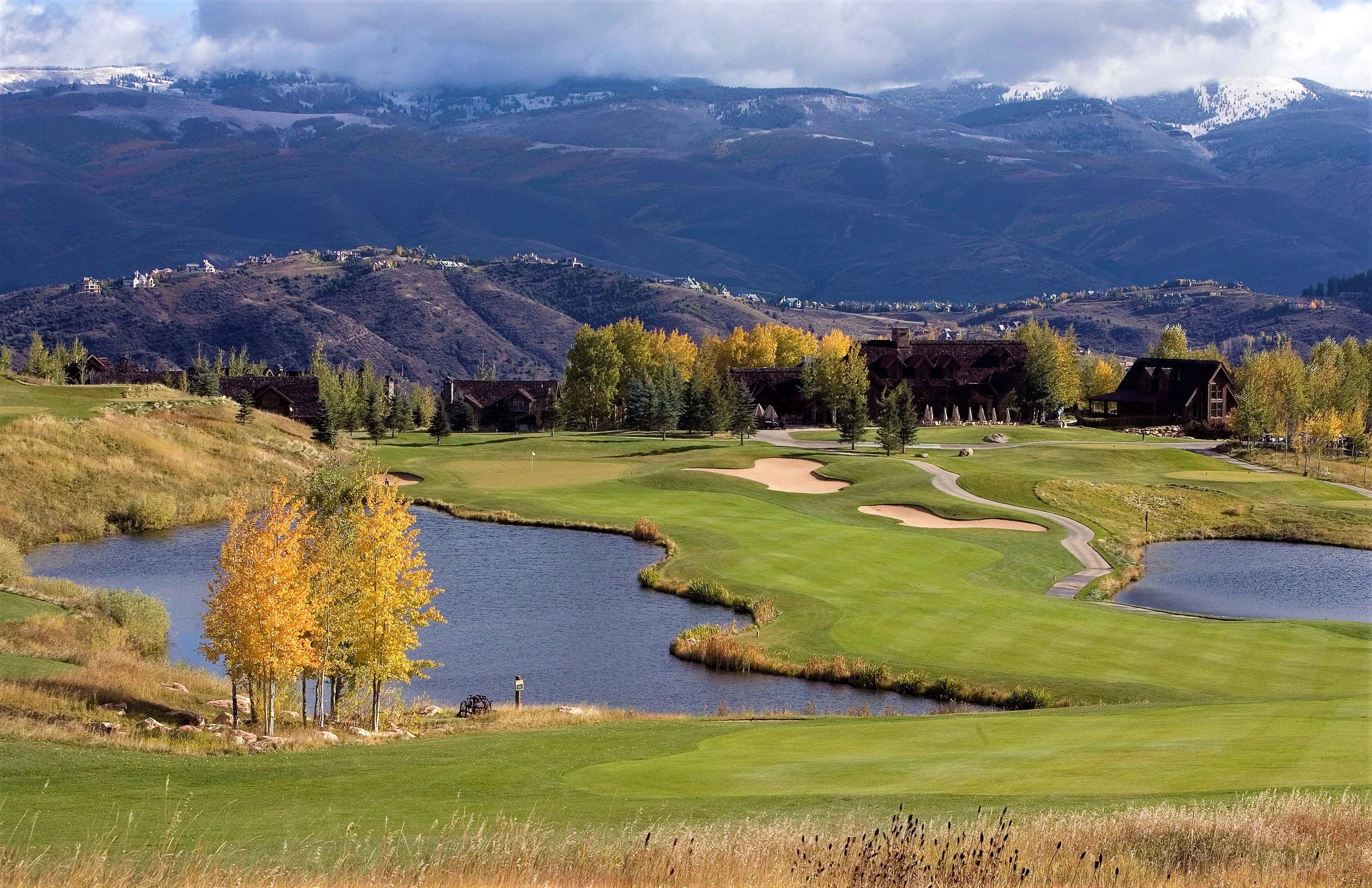 A golf course with green fairways highlighting the beauty of Vail Valley and the lifestyle represented by Danielle Huidekoper, LIV Sotheby's International Realty.