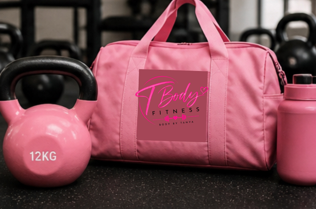 Pink fitness bag, kettlebell marked 12kg, and water bottle on gym floor.