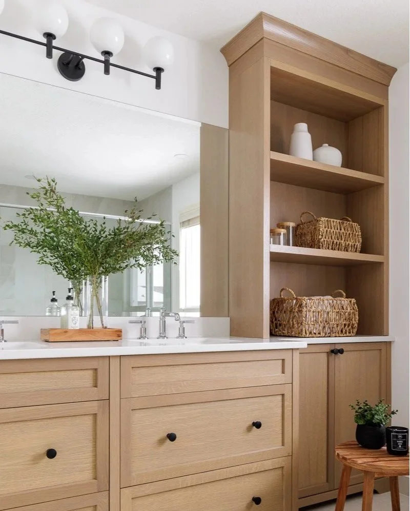 A bathroom vanity with rift cut white oak cabinetry.