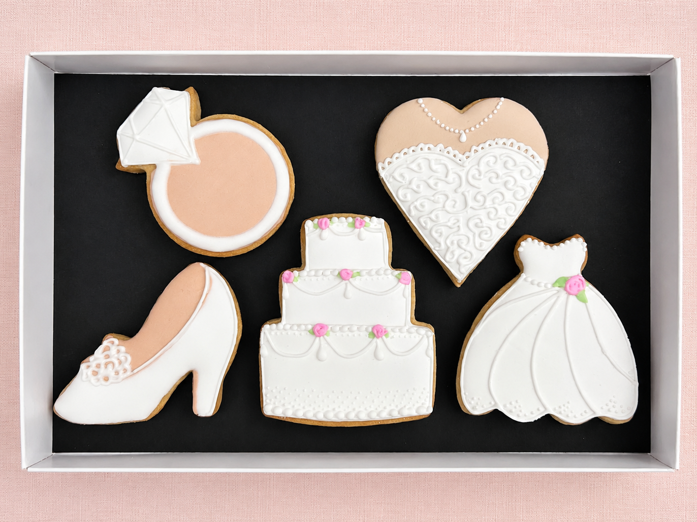 Hand-iced white wedding favours, bride or bridesmaid thank you gifts. Delivery across UK