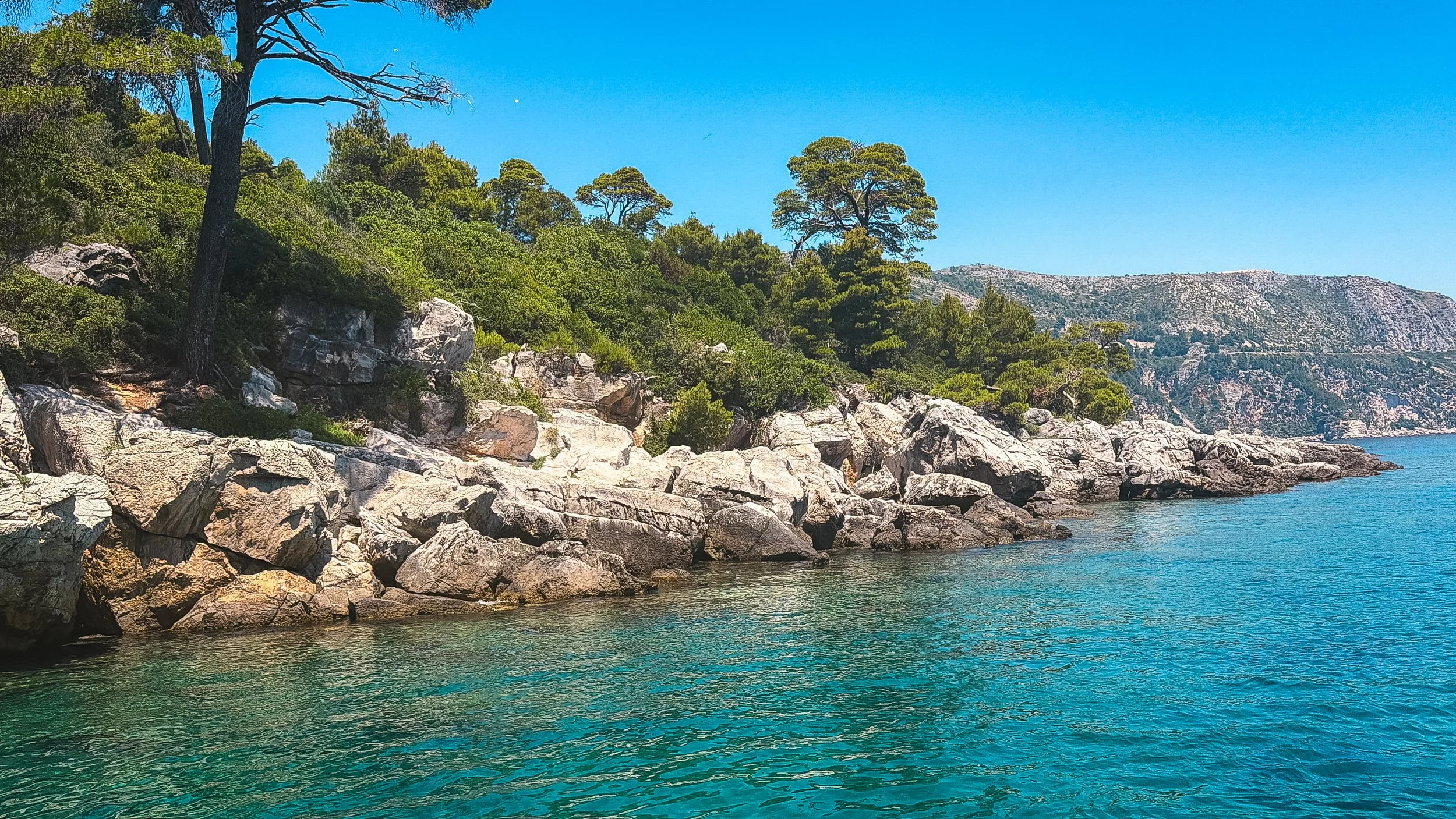 Rocky coastline and clear Adriatic water on Lokrum Island near Dubrovnik