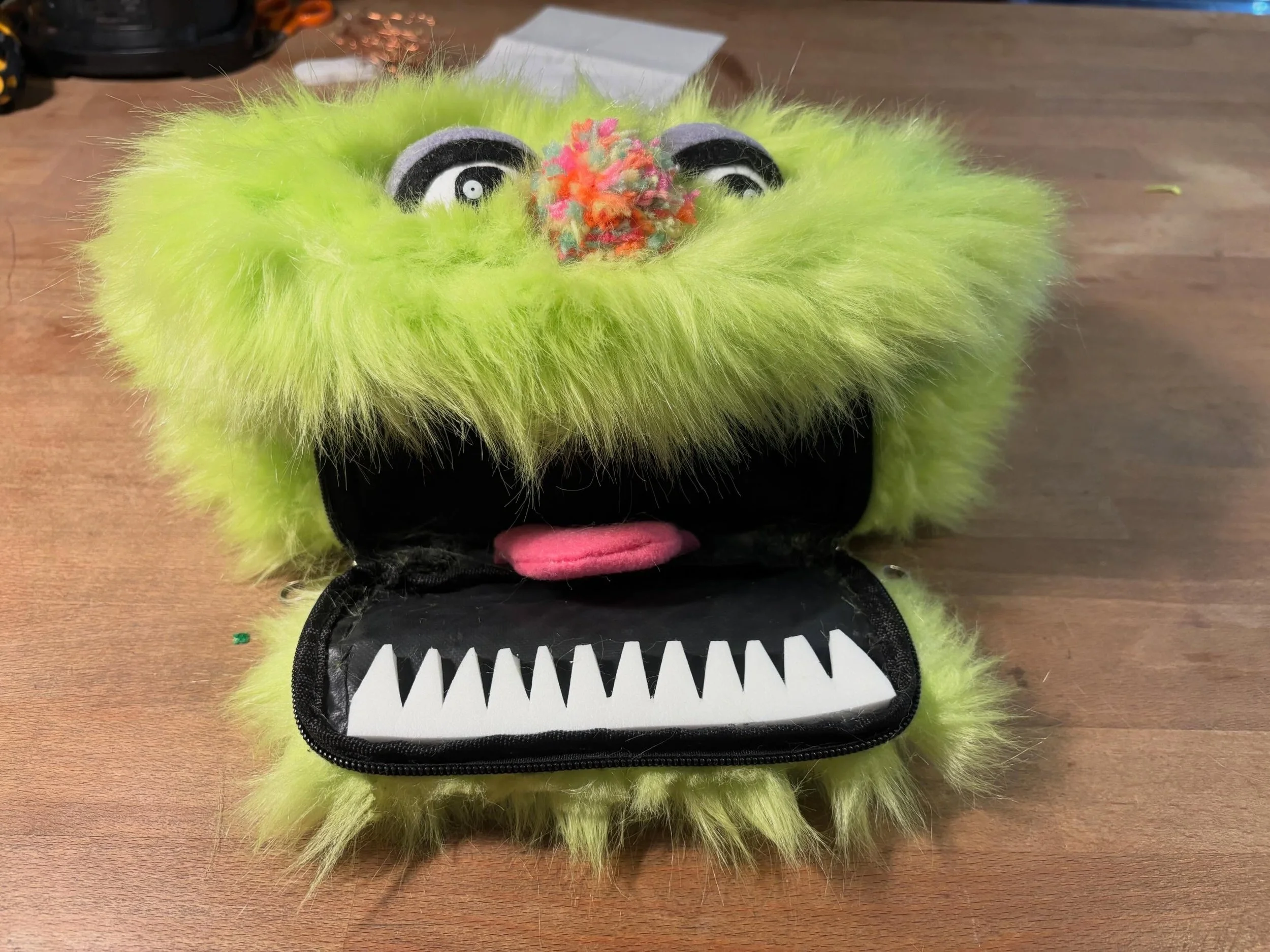 Like many of my ideas this one came to me from left field.  I have a ton of this lime fur, scored from a deadstock warehouse in LA, and had been itching to make a monster. Then I found a black fanny pack in my studio- I think someone left it in our c