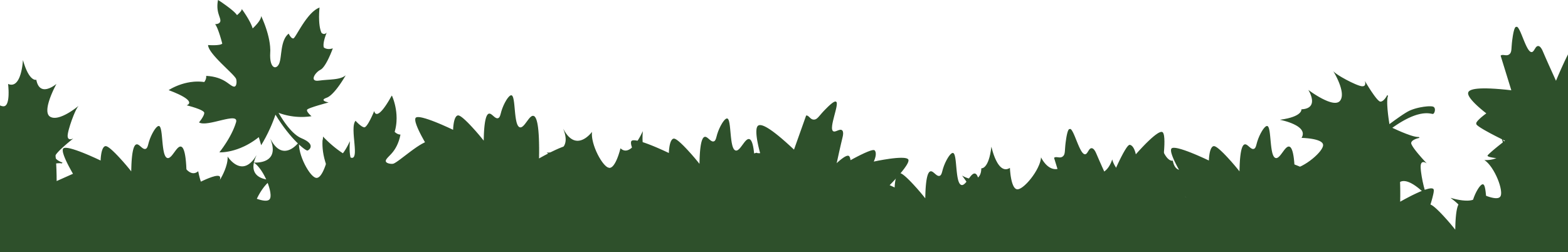 Silhouette of green bushes and plants on a black background.