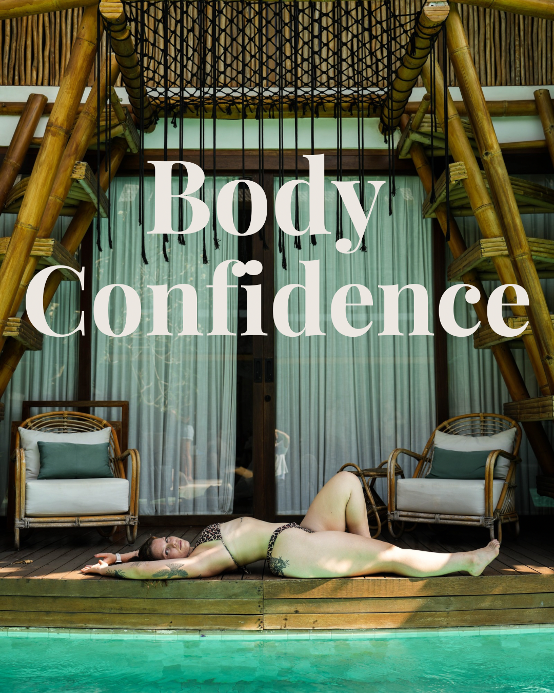 Woman lying poolside under wooden outdoor structure with large text overlay reading 'Body Confidence'.
