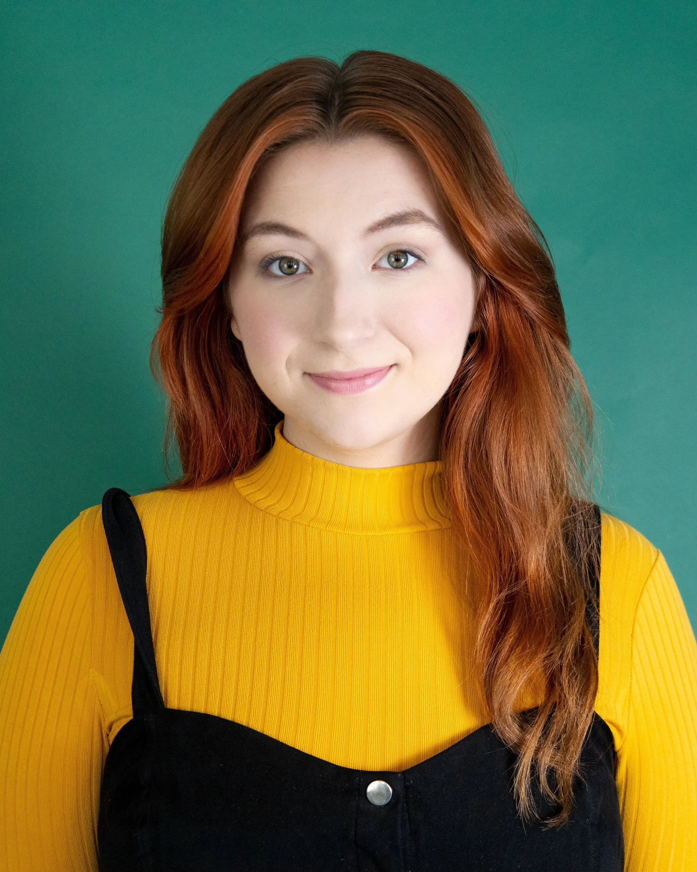 A headshot of MK Prophett (they/she), Director of Community Engagement for Make Good Theatre Company.