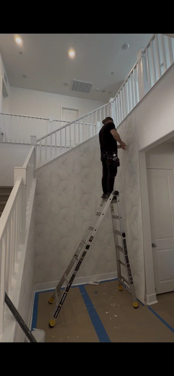 Professional wallpaper installer working in Los Angeles home — Agai Wallpaper