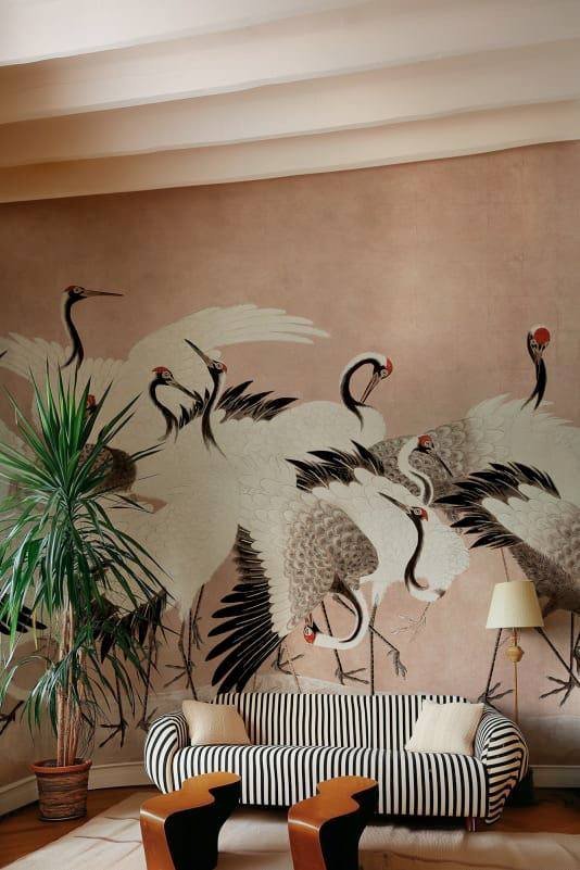 Mural wallpaper installation in Los Angeles living room — crane design accent wall