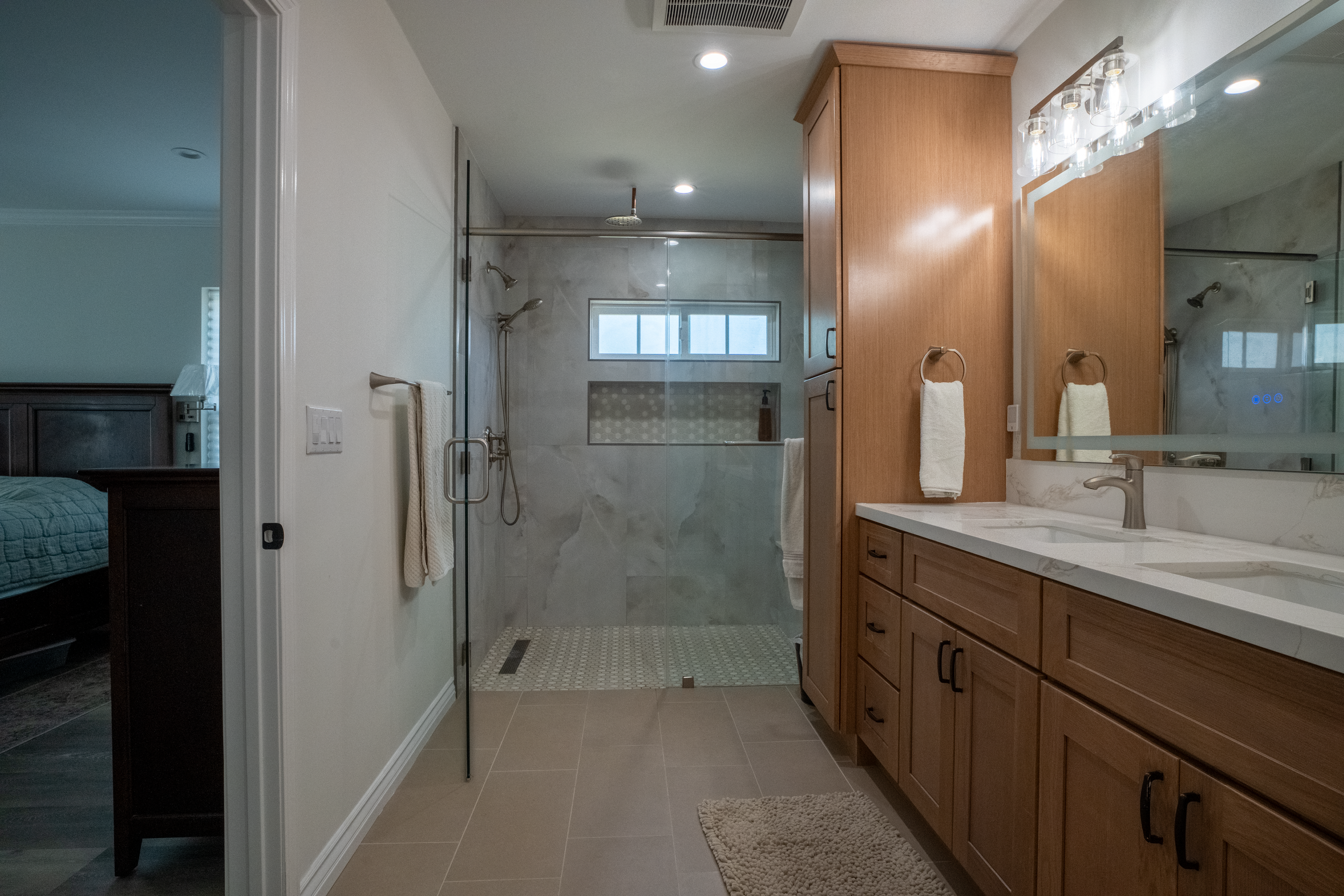 Remodeled bathroom with dual sink. 