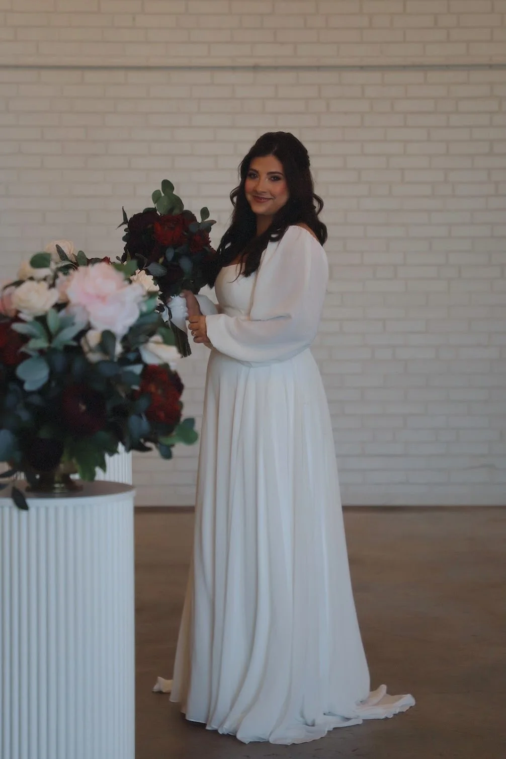 happy bride holds bouquet on flowers in charlotte north carolina