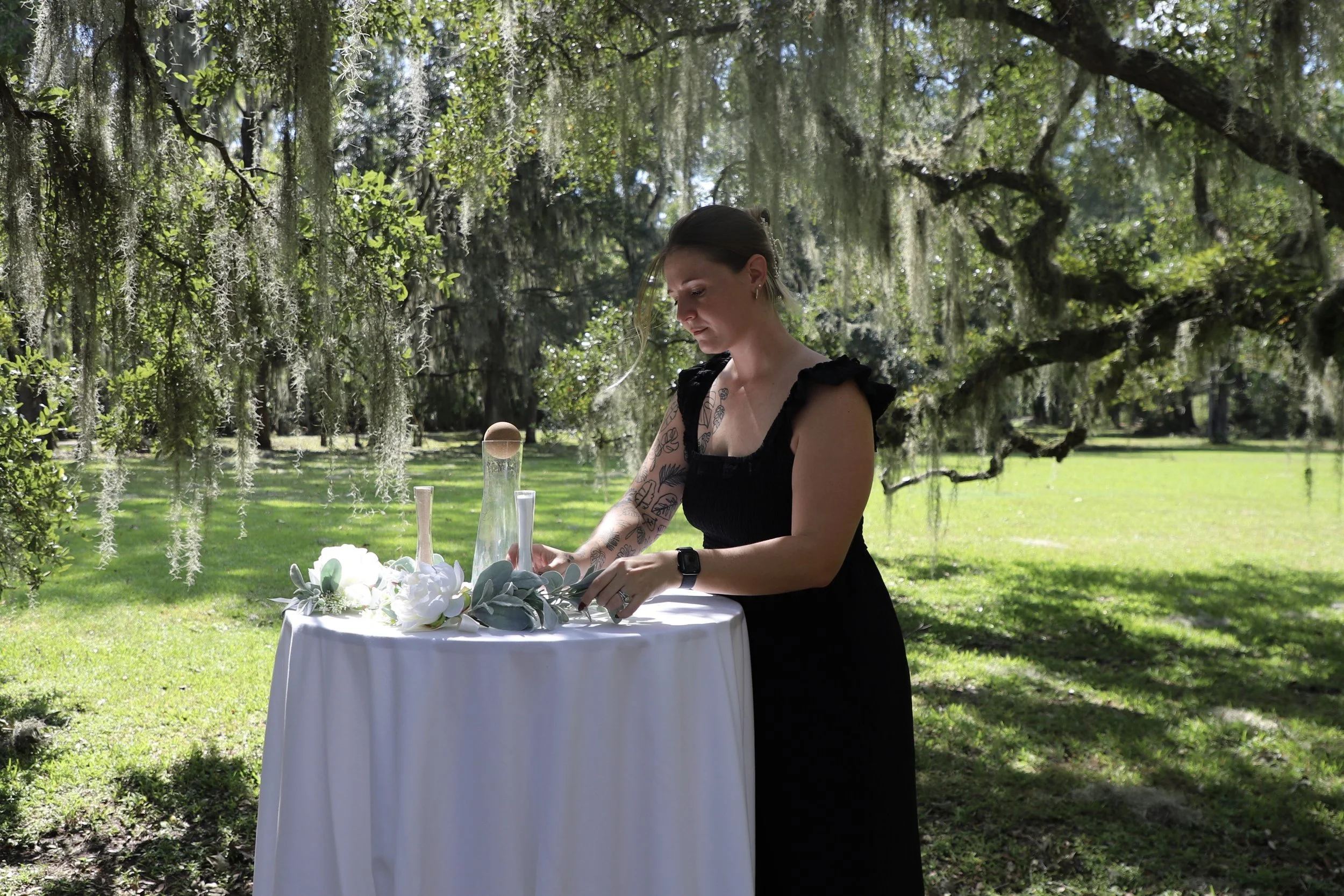 Making final touches at Charleston wedding ceremony outdoors