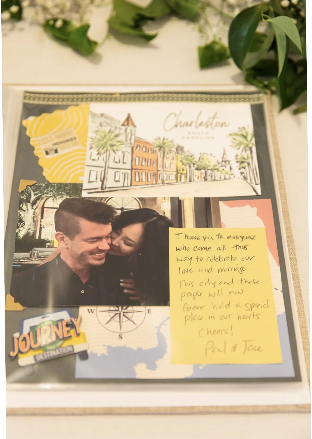A collage containing a drawing of Charleston, South Carolina, a photo of a smiling couple, a yellow sticker with 'Journey' on it, a map behind the photo, and a handwritten note expressing gratitude and love.