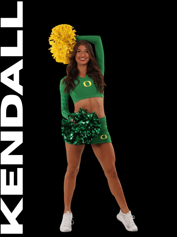 A cheerleader in a green Oregon Ducks uniform holding green pom-poms, standing in front of a black background with the word 'KENDALE' written vertically on the left side.
