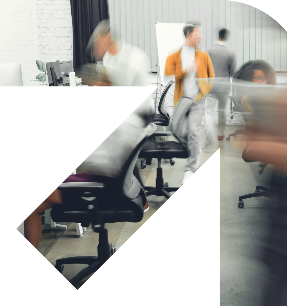 Bunbury Physio - Blurred motion of people working in an office with chairs, desks, and a whiteboard in the background.