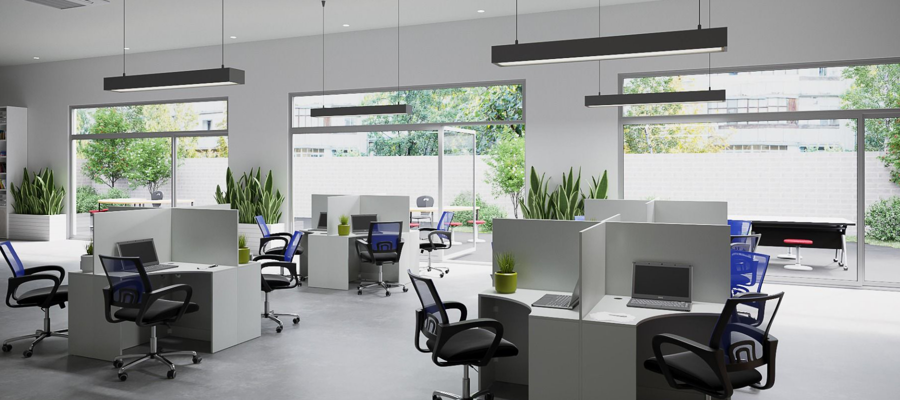 Bunbury Physio Sylex Office Furniture - Modern office with desks, computers, and chairs, large windows with outdoor view and greenery.